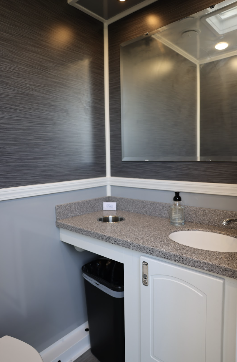 Luxury restroom trailer interior with elegant sinks and mirrors
