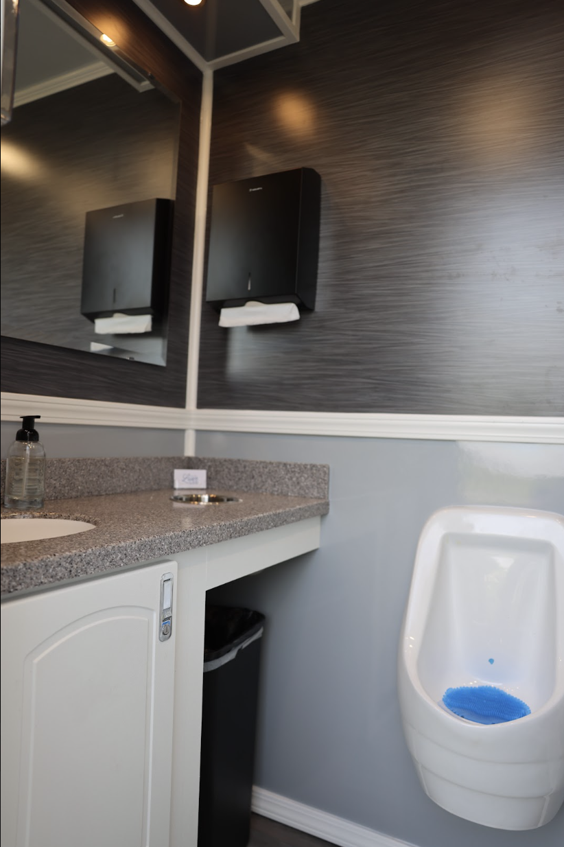 Clean and elegant restroom trailer interior for weddings