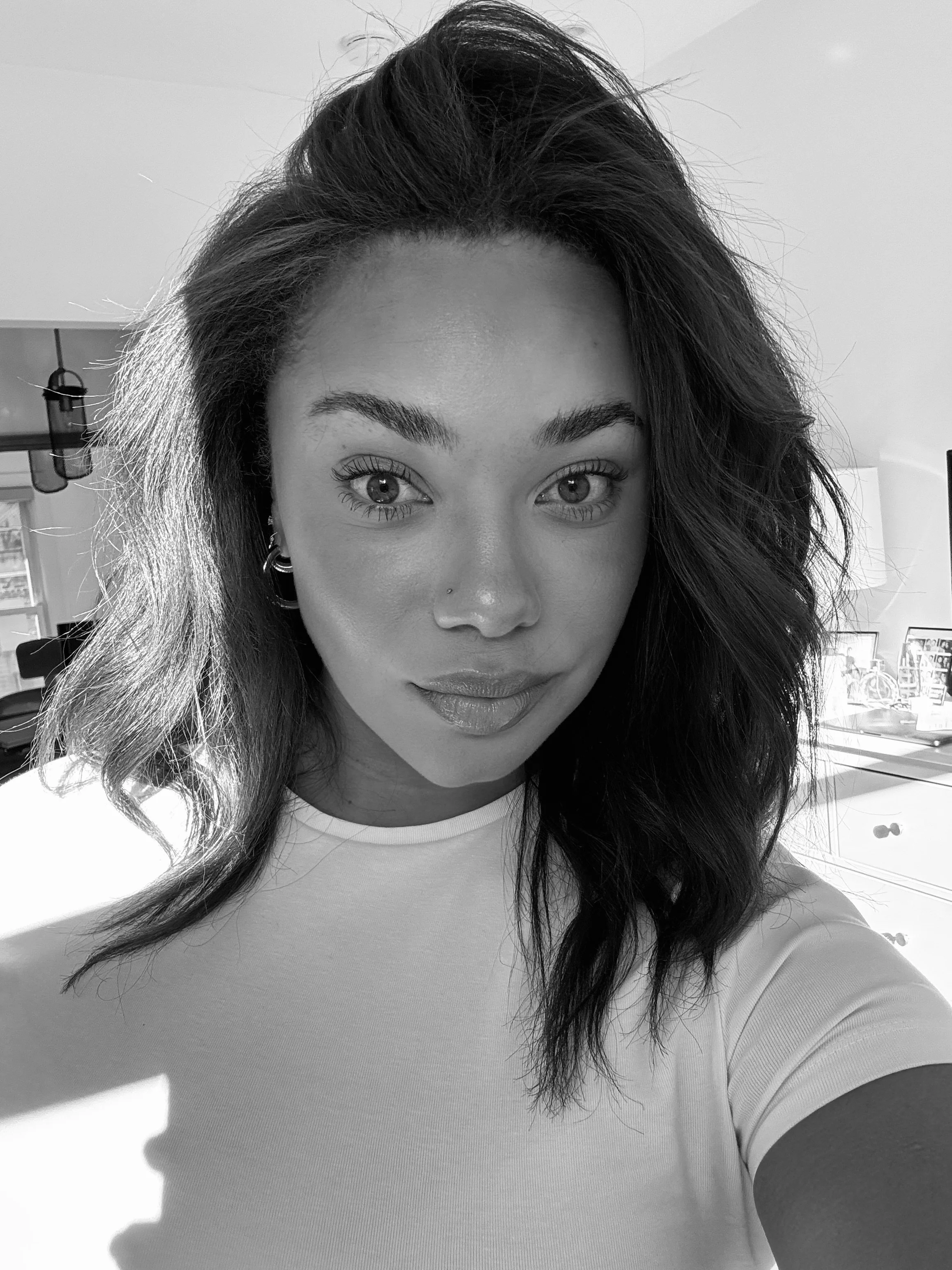 picture of person with medium length hair in black and white