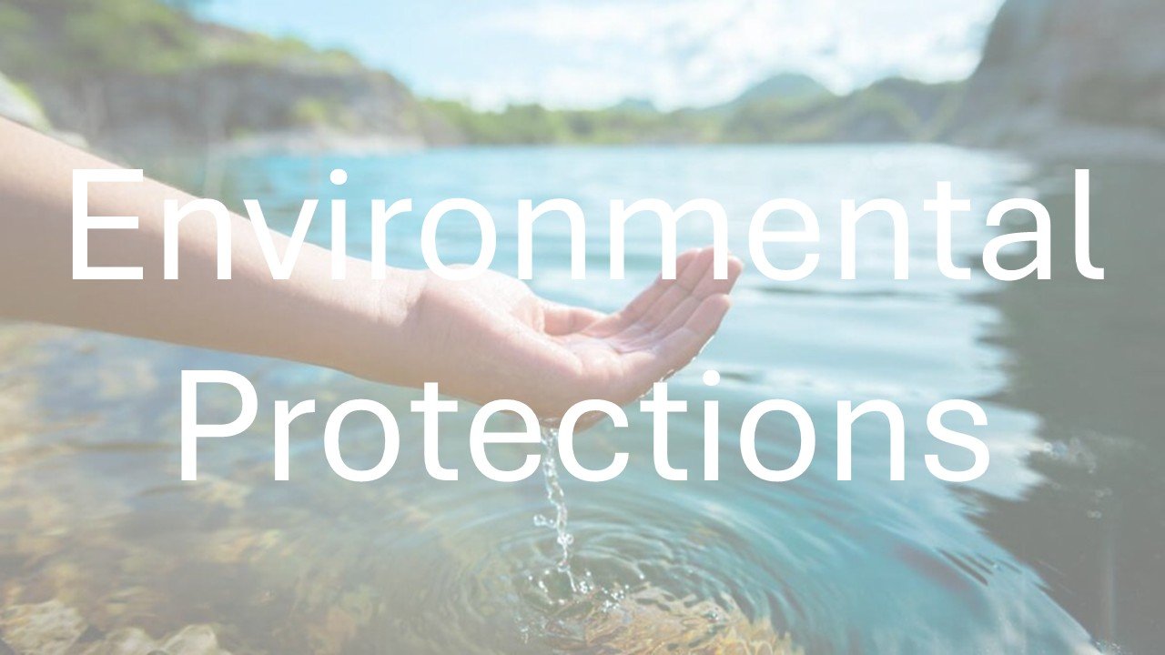A person’s hand reaching into water near a riverbank with mountains in the background, overlaid with the text 'Environmental Protections'.