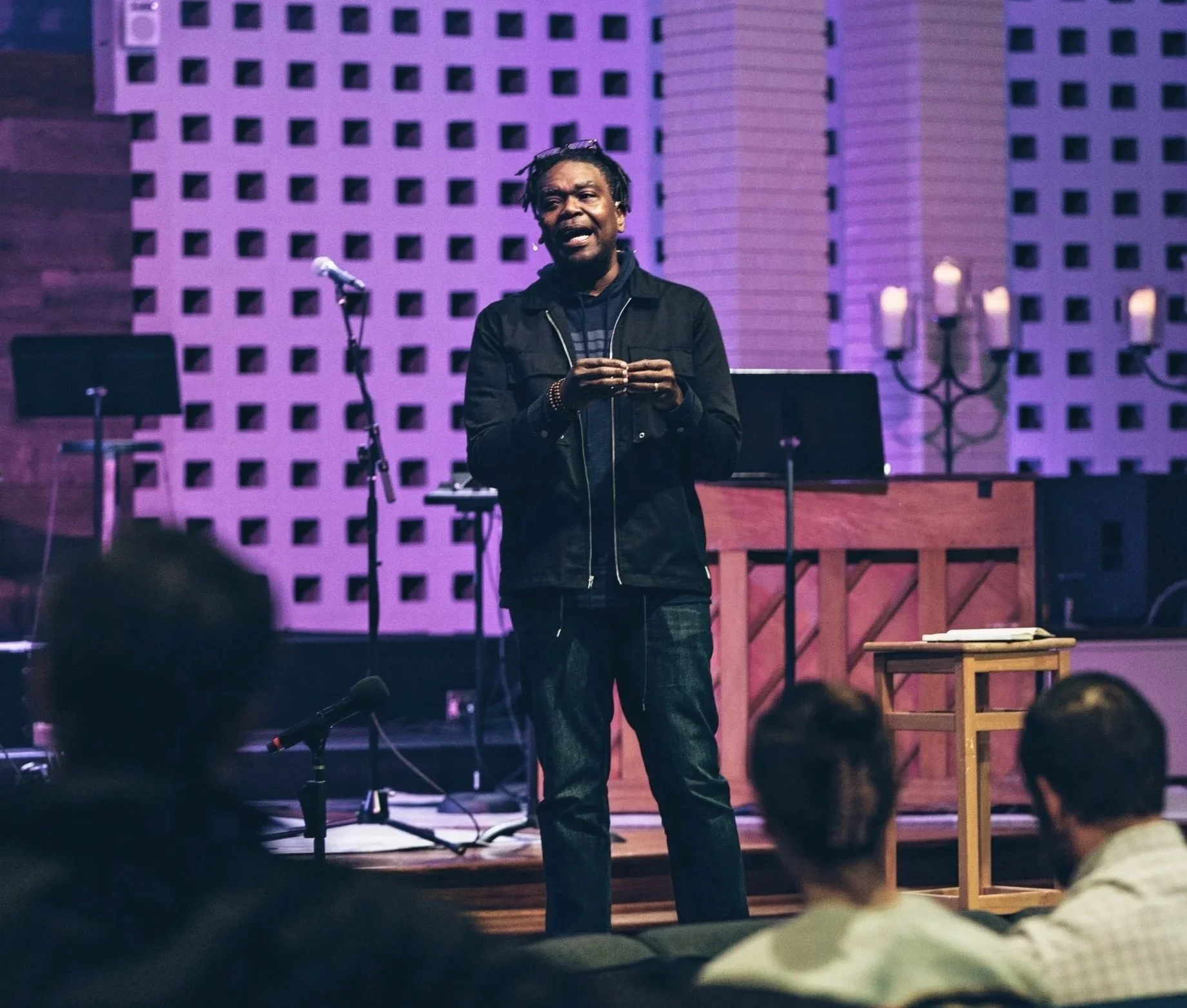 Sean Palmer preaching to a seated congregation