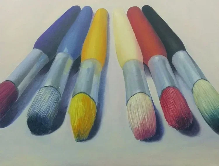 Drawing of seven colorful paintbrushes arranged in a line, with bristles facing downward, featuring various colors including purple, blue, yellow, white, red, black, and green.