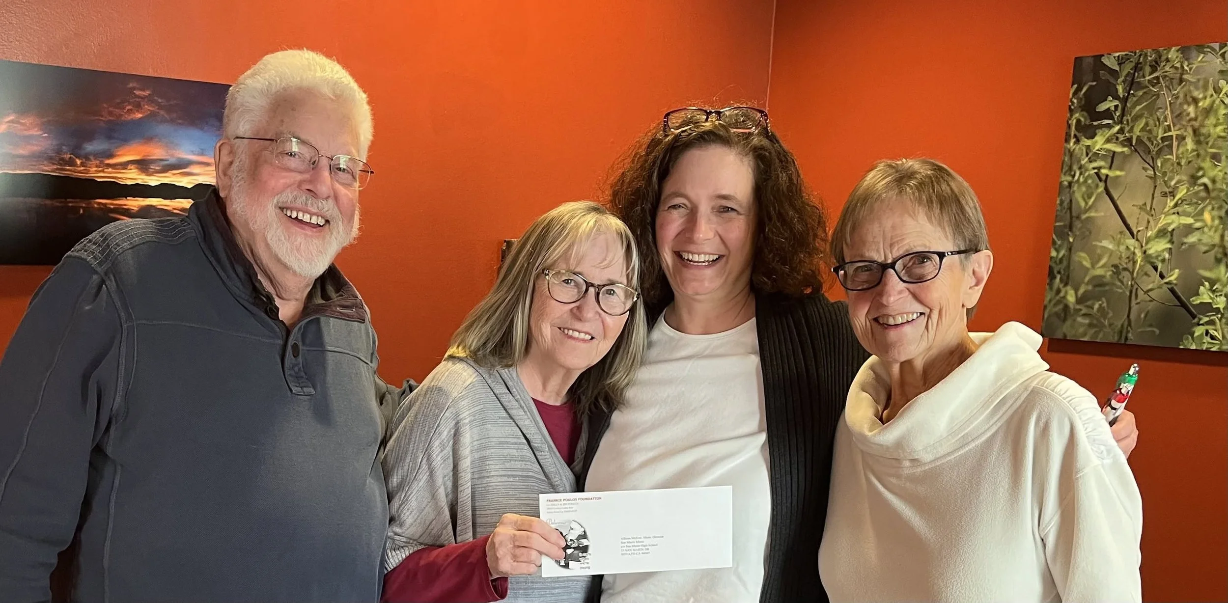 Frankie Poulos Foundation presenting Ms. McIvor and Mrs. Gates with a sponsor check.