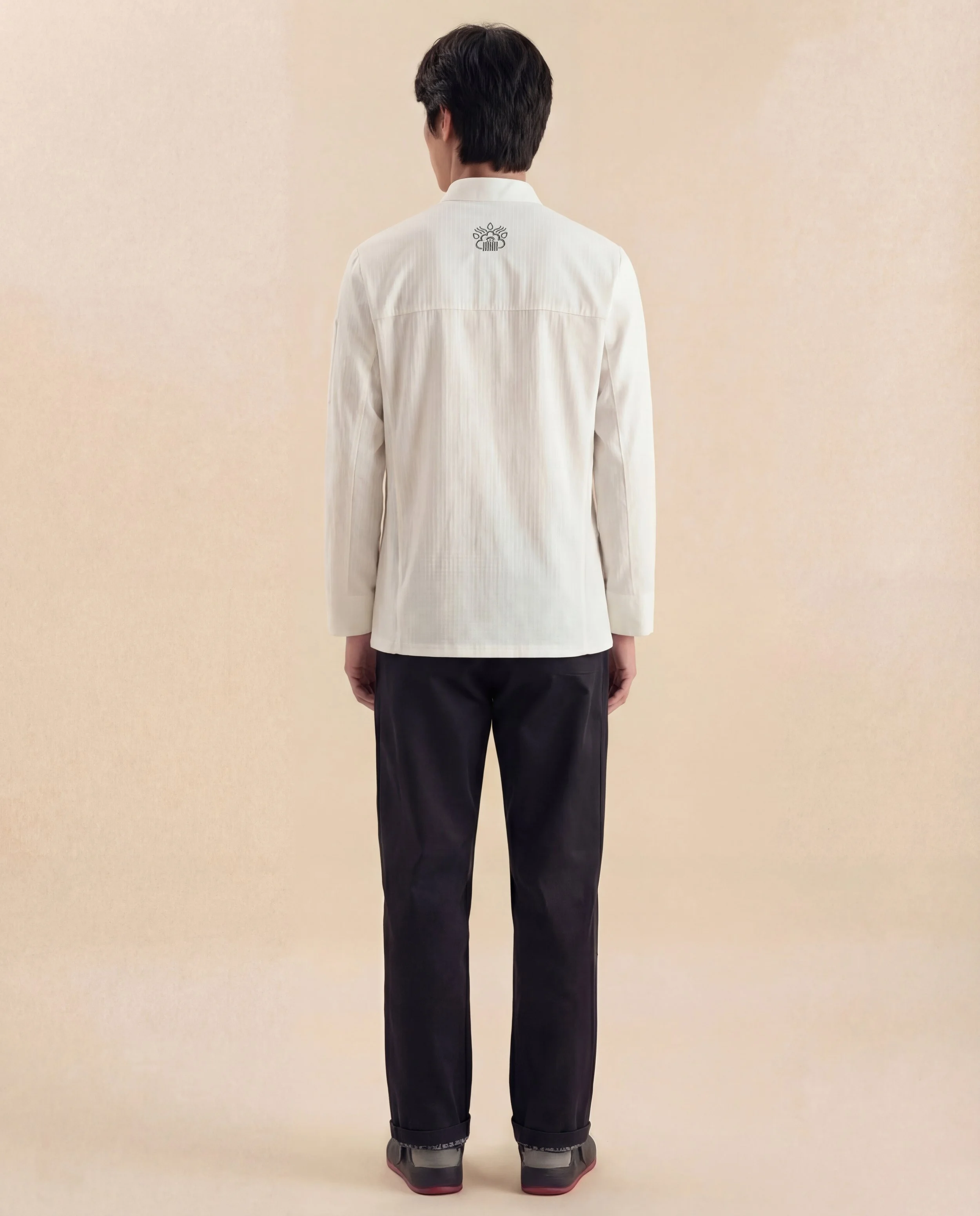 ChefShield™ Pro Chef Jacket shown from the back, highlighting its clean silhouette, structured construction and professional kitchenwear design.