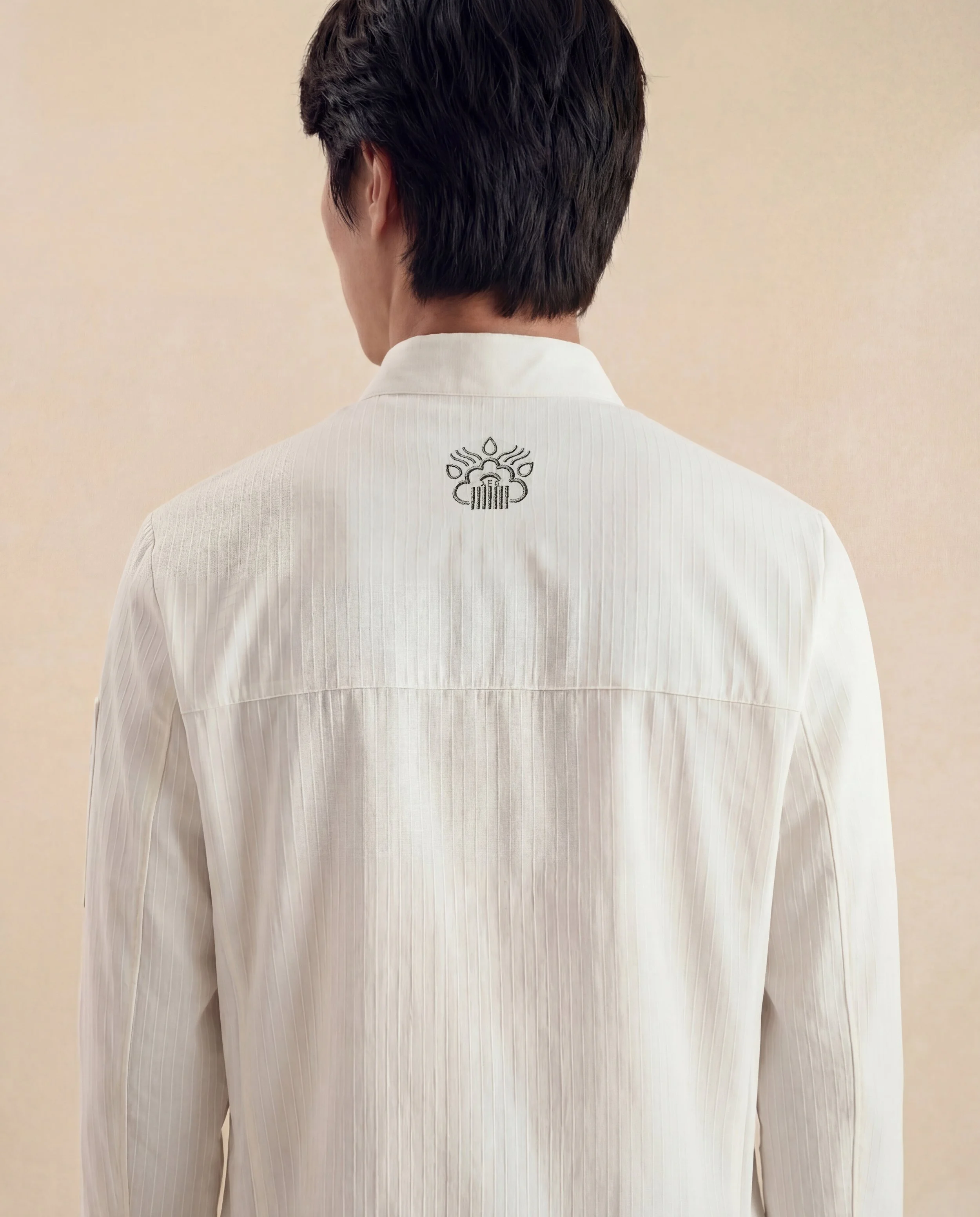 Side view of the ChefShield™ Pro Chef Jacket showing its ergonomic fit, enhanced ventilation side mesh and functional design for professional chefs.