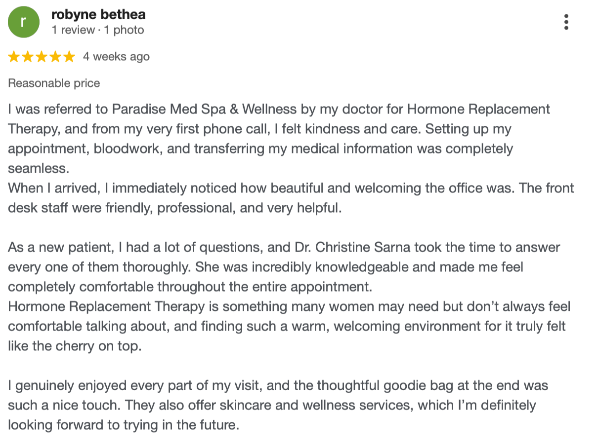 A customer review for Paradise Med Spa & Wellness expressing satisfaction with hormone replacement therapy and the staff's professionalism, knowledge, and welcoming environment.