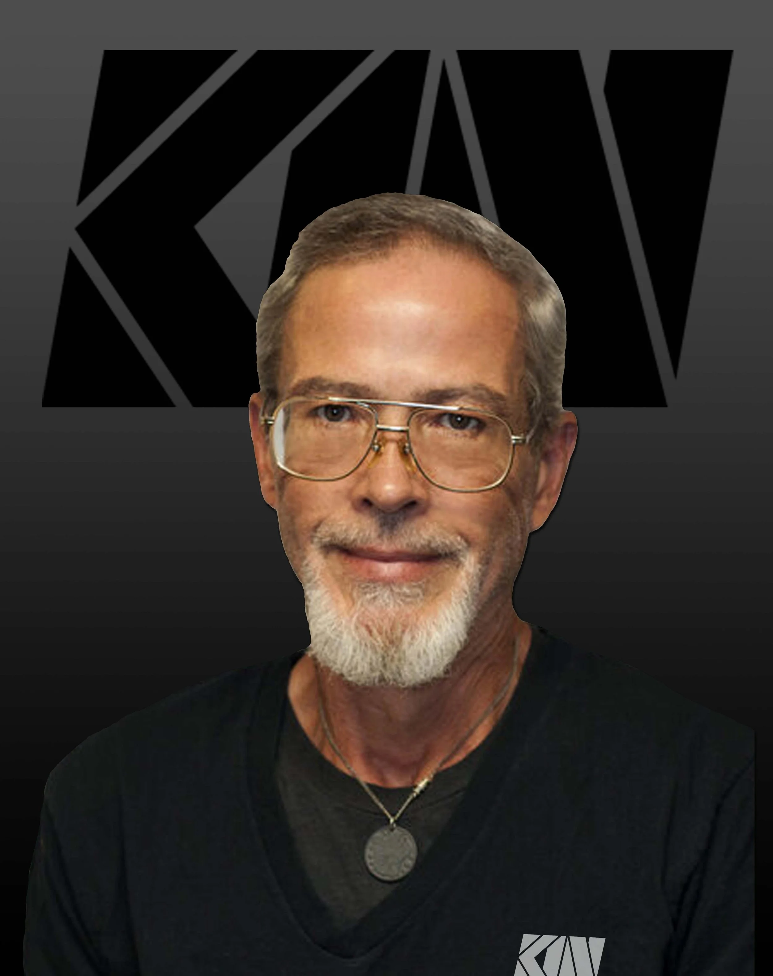Close-up of a man with gray hair, glasses, and a beard, wearing a black shirt, with a background featuring large black geometric shapes on a gray backdrop.