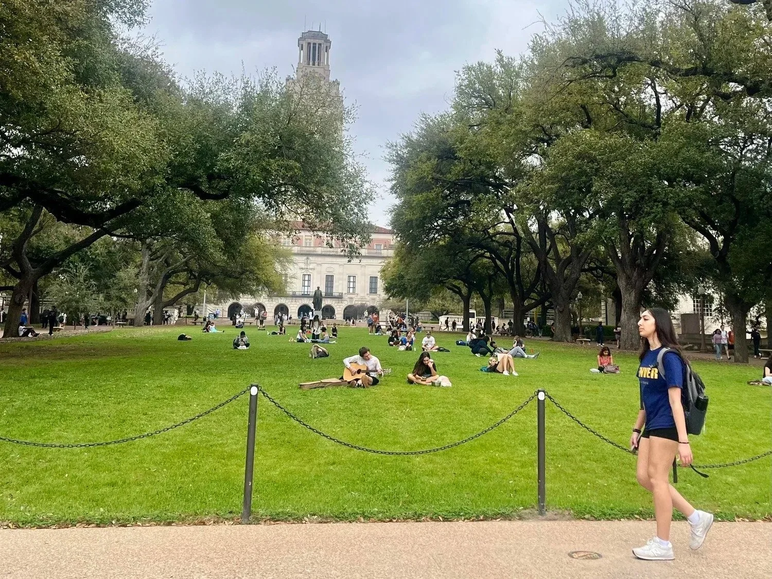  Students lounge at the lawn by UT’s Tower on Feb. 26, 2024, in Austin, Texas. 56 percent of all Longhorns receive some form of financial aid, and families with adjusted gross incomes of $125,000 are guaranteed need-based assistance through the Texas