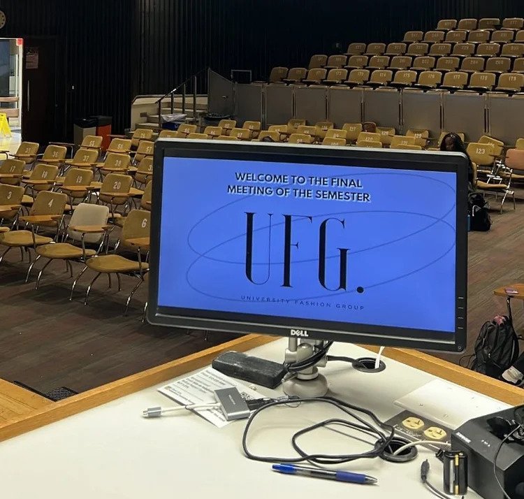  University Fashion Group President Faith McNabnay sets up the slidedeck for the organization’s final general meeting of the semester and waits for members to enter the Flawn Academic Center on April 9, 2024. (Photo credit: Sonali Menon)  
