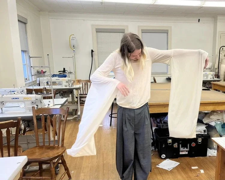  Brogdon models his newly crafted shirt after stitching its seams in the collections capstone classroom on April 10, 2024. Brogdon said he wanted to check the size, silhouette and flow of his newly made garments and get opinions from his peers. (Phot