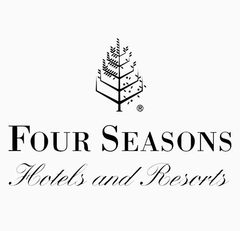 Logo for Four Seasons Hotels and Resorts featuring a stylized tree with text.