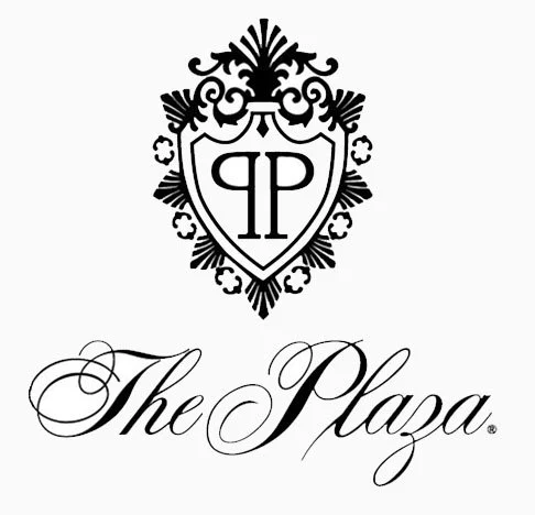 A logo featuring a crest design with the initials 'PP' inside a shield, above the text 'The Plaza' in elegant cursive script.