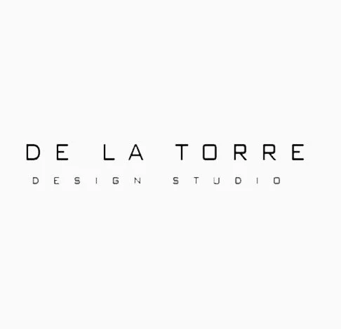 Logo for De La Torre Design Studio with black text on a white background.