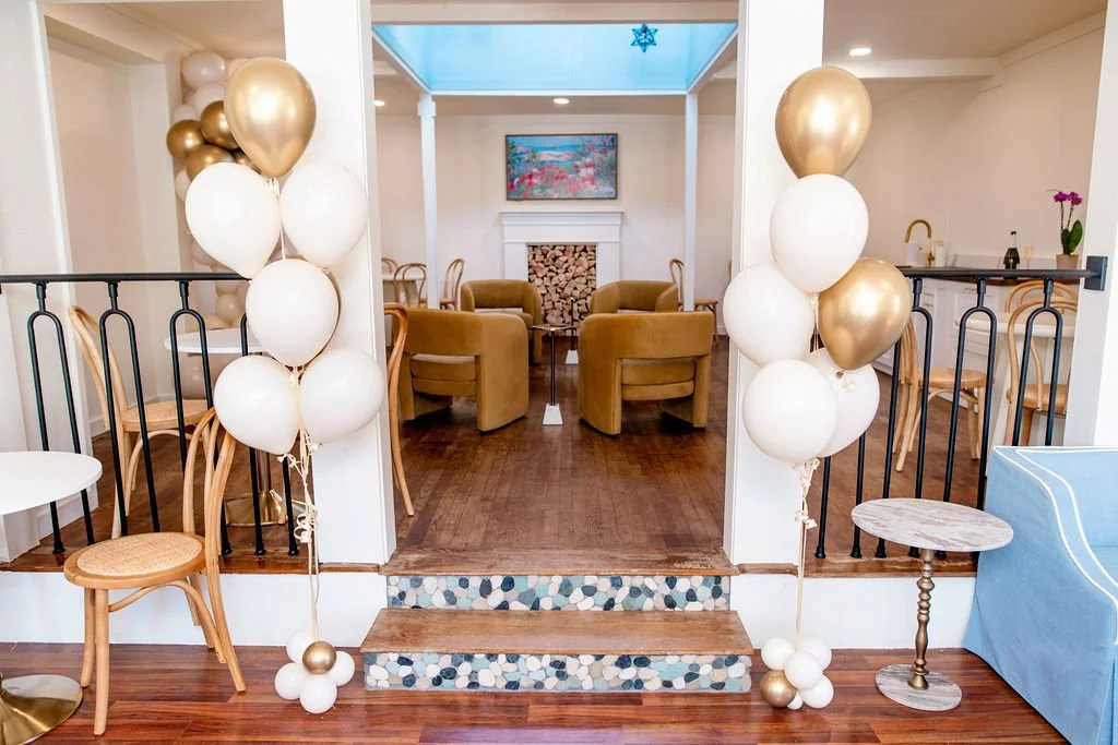 Event backdrop with balloons at Leigh's