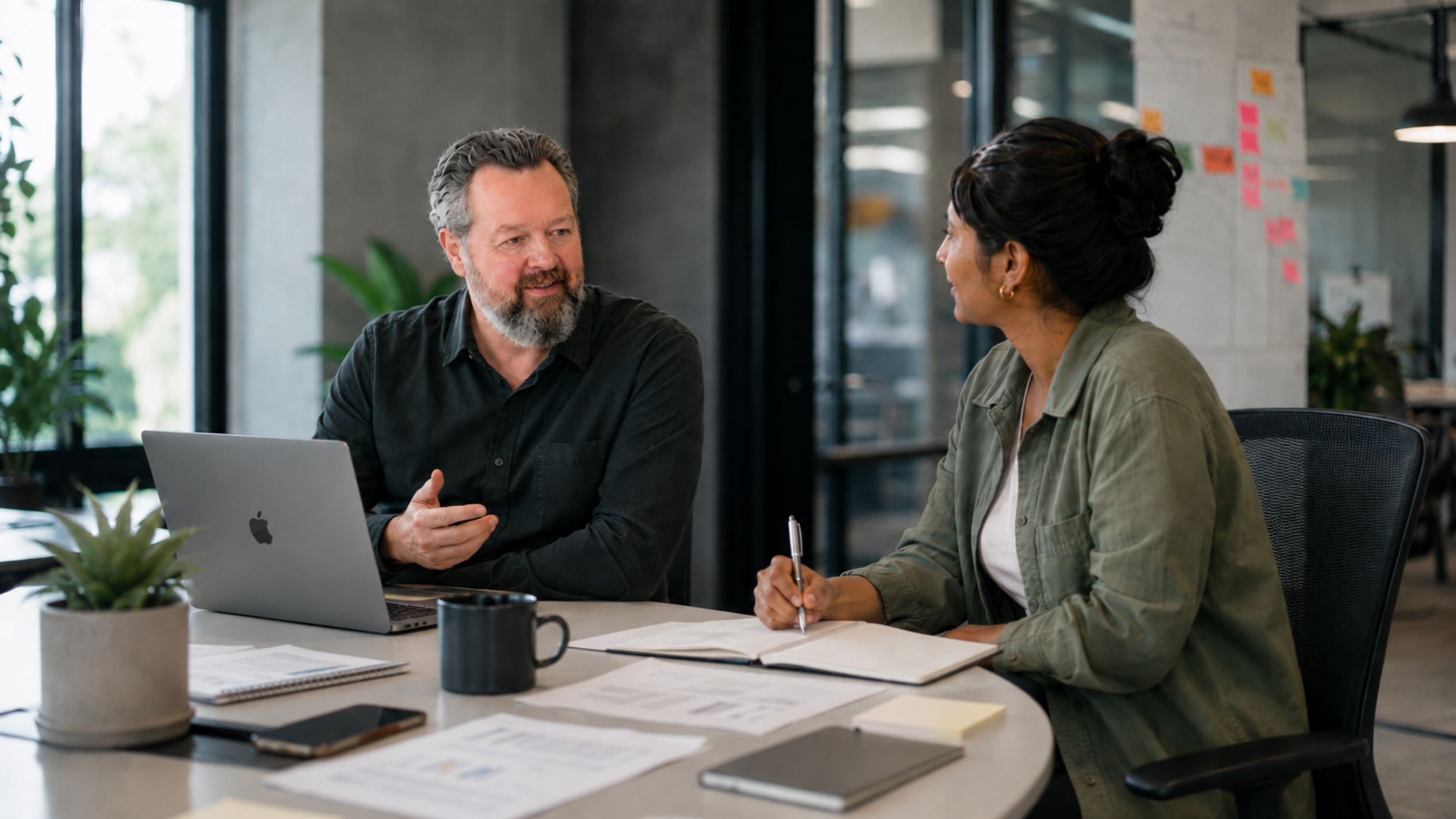 Jason Jackson, operating partner, coaching a growth-stage founder in a working session
