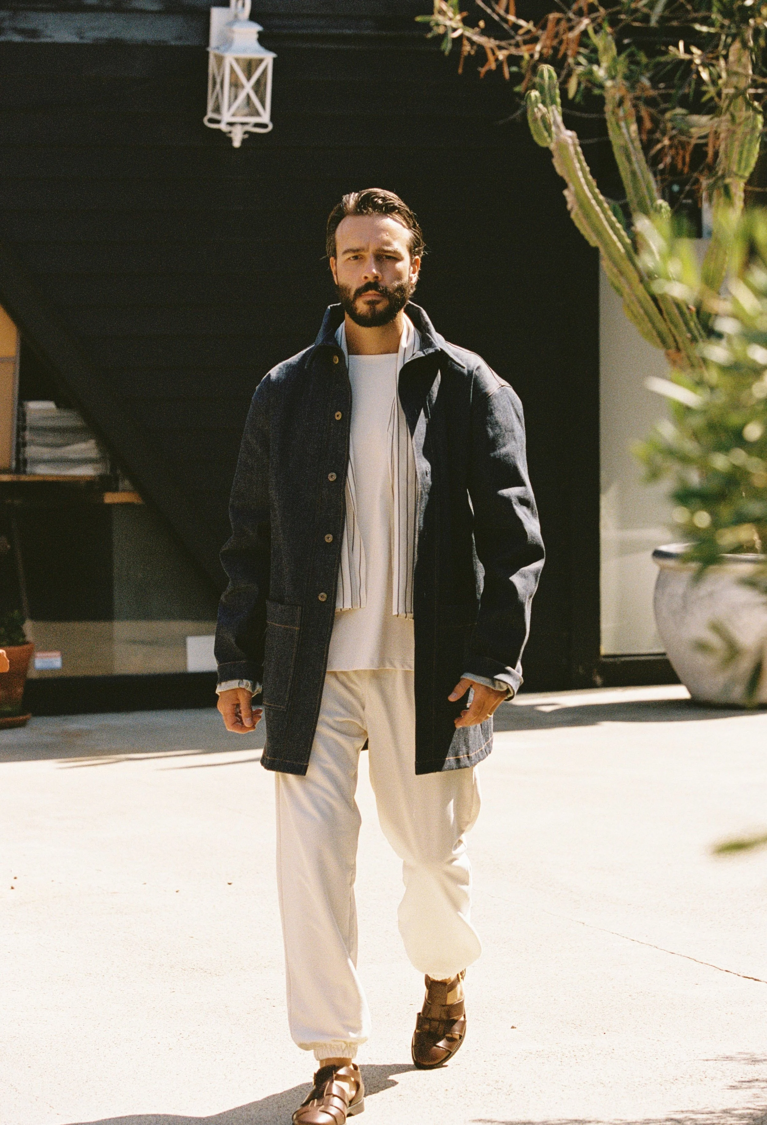 Casual menswear — dark denim coat and cream trousers, SÔZ Studios Atelier Los Angeles apparel product development and domestic manufacturing consultant. 