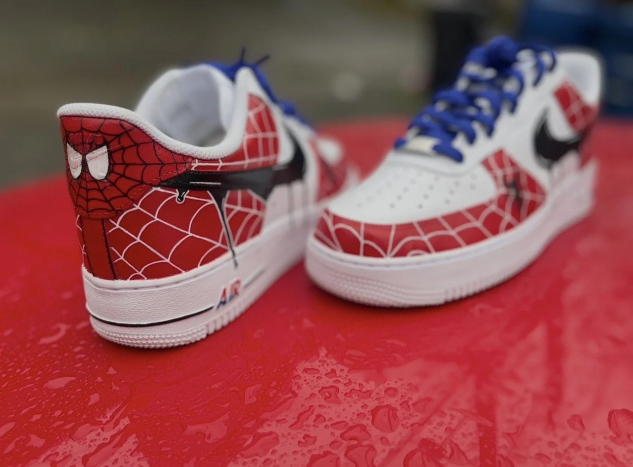 Heel artwork on Spider-Man custom Air Force 1 featuring hand-painted spider eyes and web design
