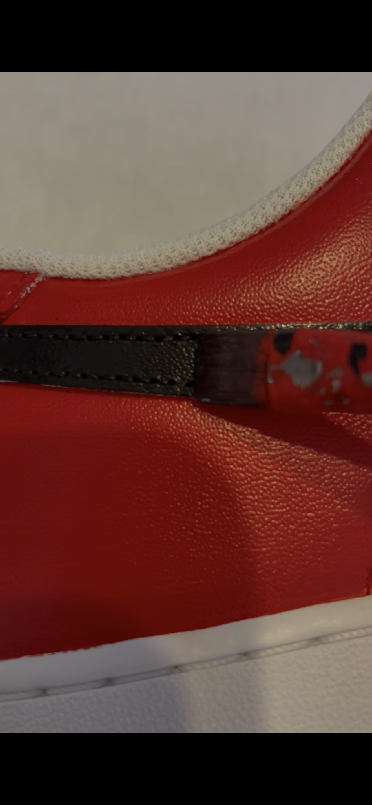 Artist painting a custom Nike Air Force 1 sneaker by hand