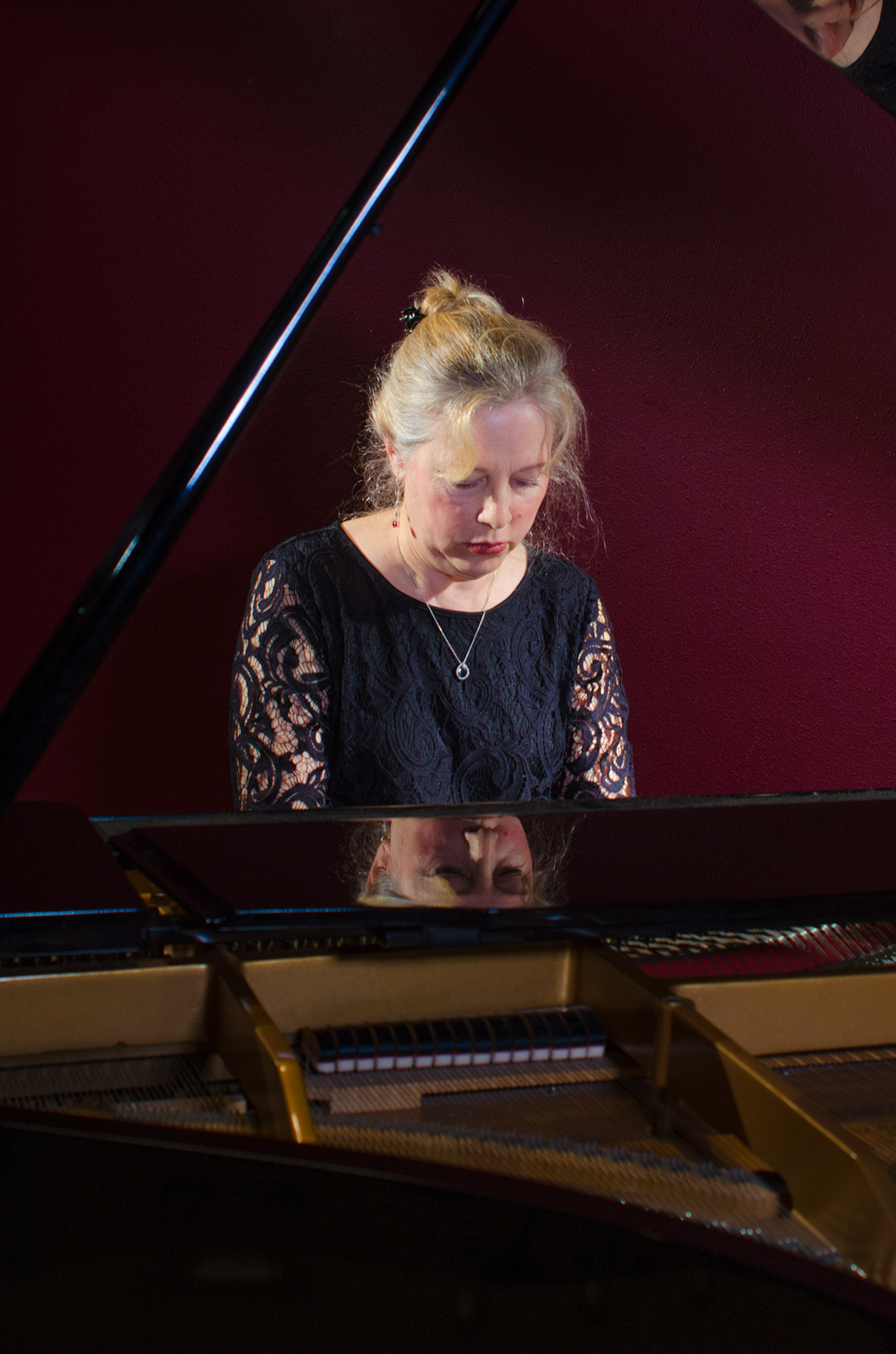 Kathryn Apland playing the piano at a Sinfonietta concert performance