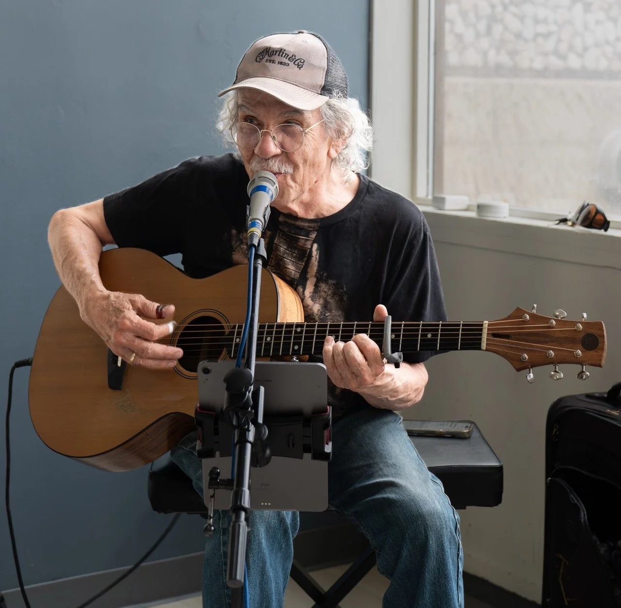 Dennis Castanares playing a guitar at Riverside Community Church at CGOA's Member Appreciation Event