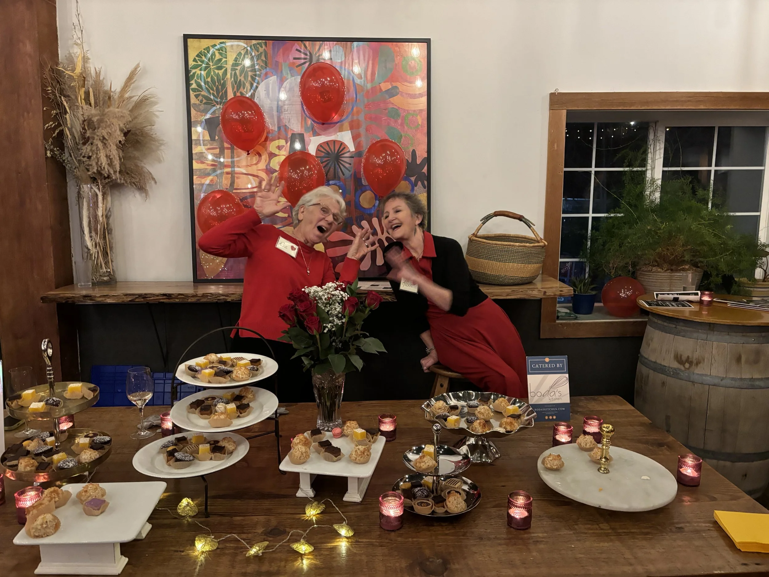Ria and Alison volunteering at the cupcake station during the CGOA Valentine dance