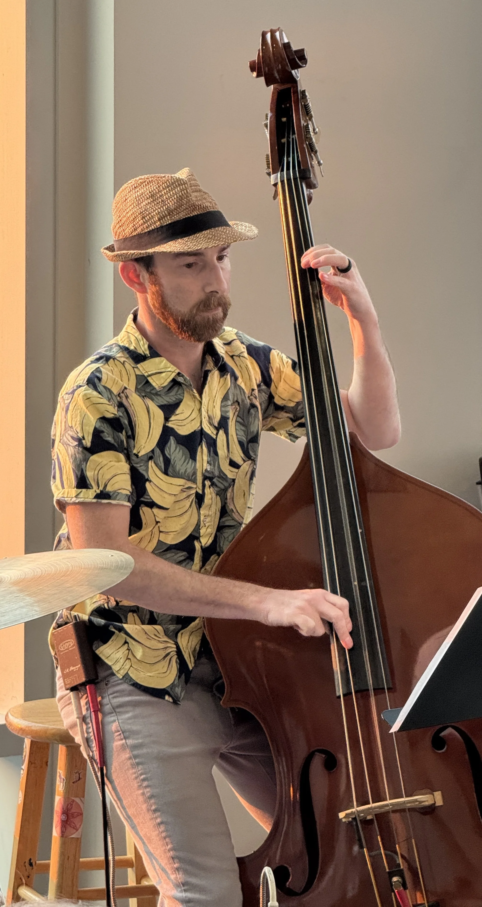 A man playing the standup bass at a Jazz Collective Big Band concert