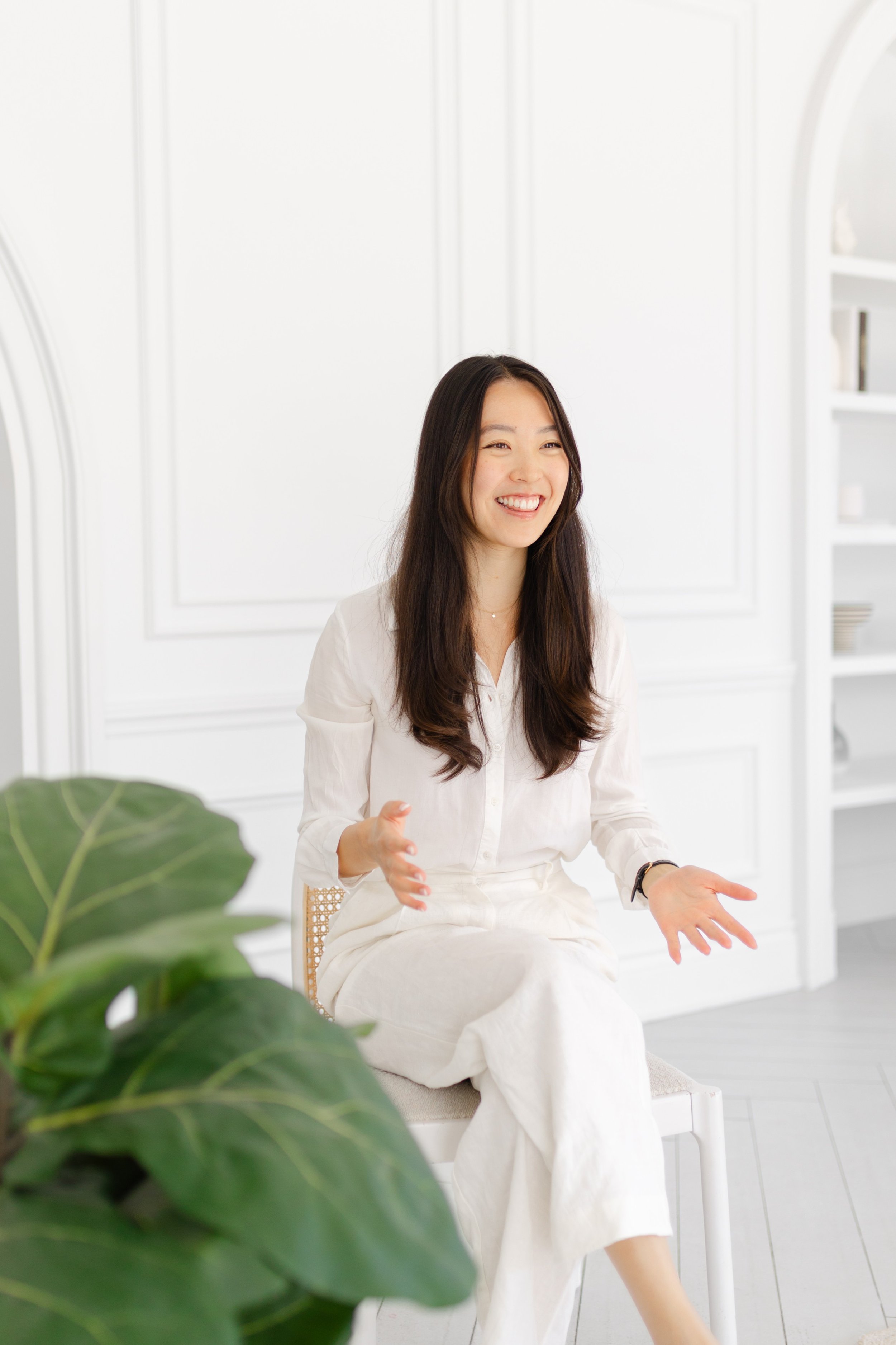 Audrey Kao, MSW, RSW, smiling in her therapy office