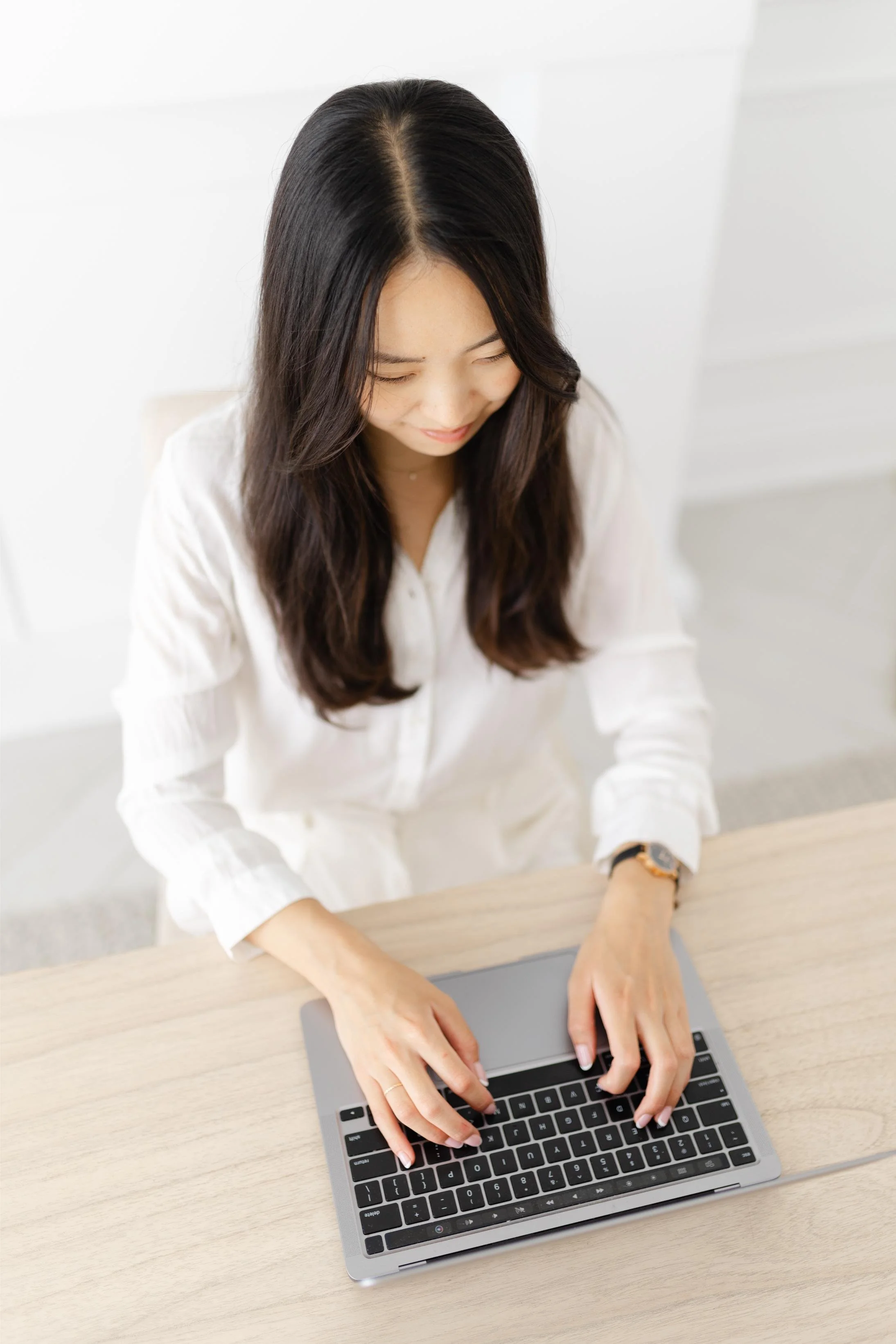 Audrey Kao, a therapist in Toronto, working at her laptop