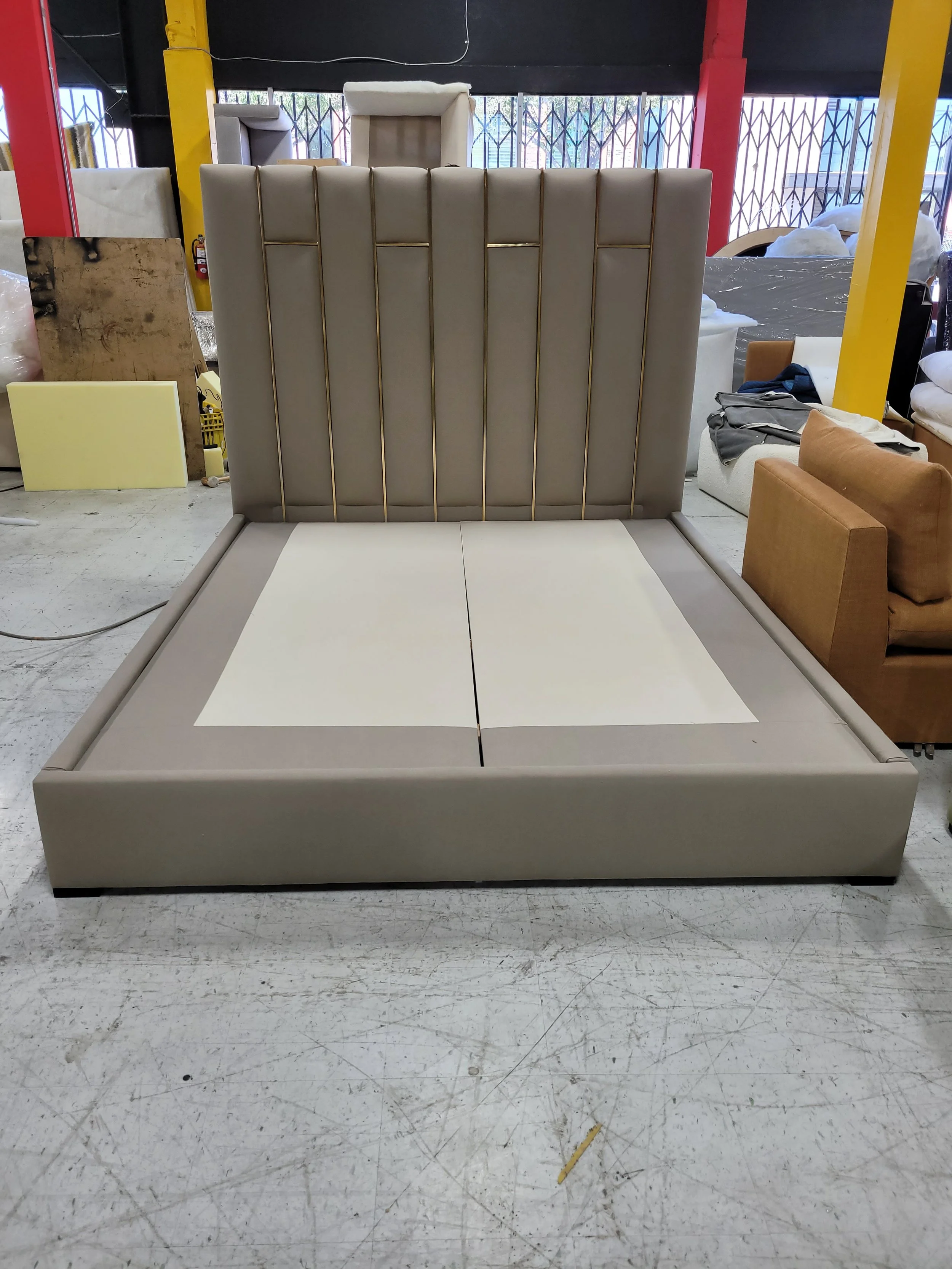 luxury-custom-upholstered-platform-bed-gold-accents.jpg