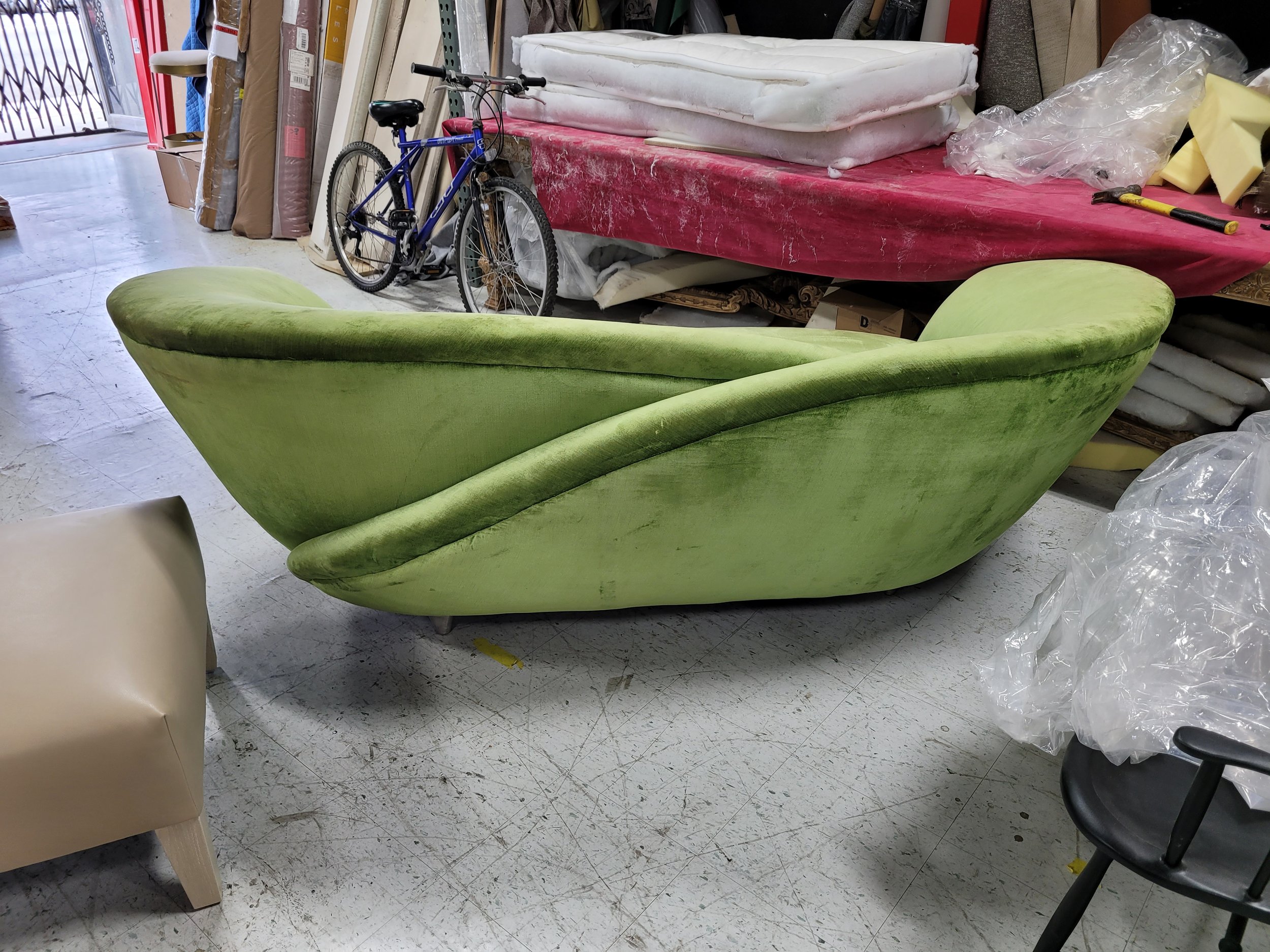 curved green velvet loveseat back.jpg