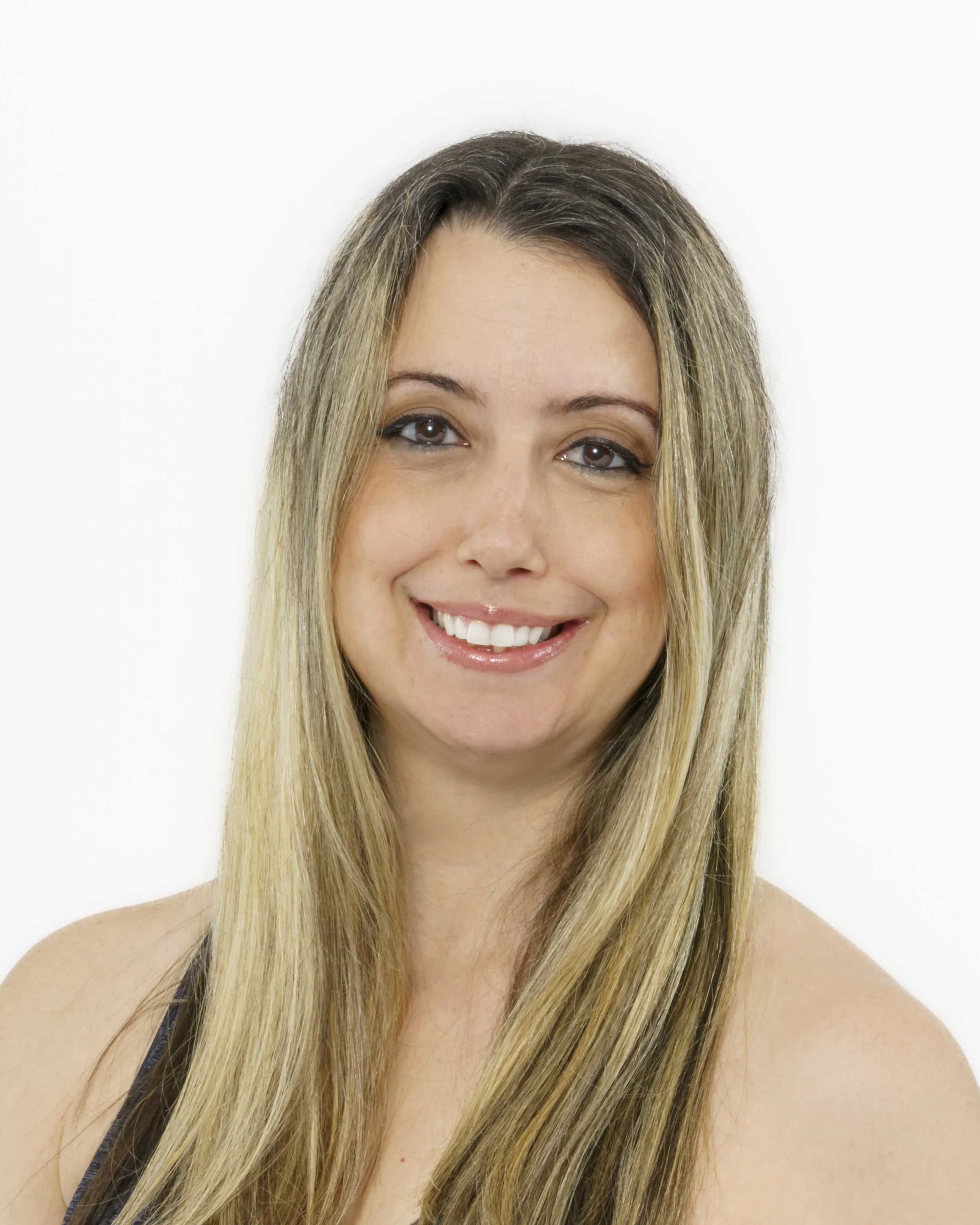 A smiling woman with long blonde hair wearing a black top, shown against a white background.