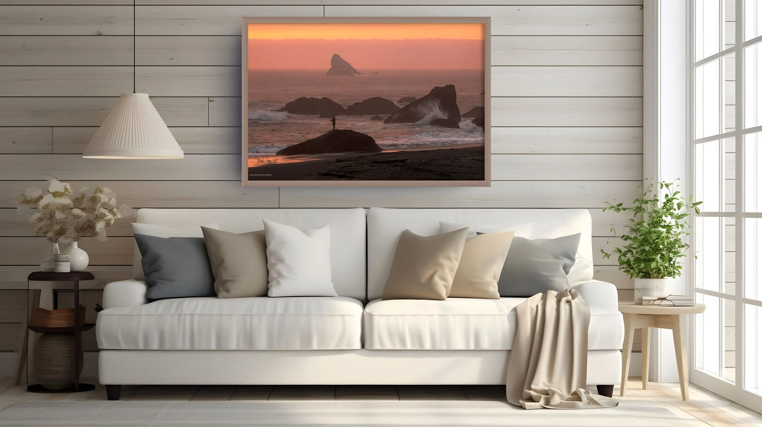 A photo of a coastal homes living room with Stan Dunlap's photo of an Oregon surf fisherman at sunset