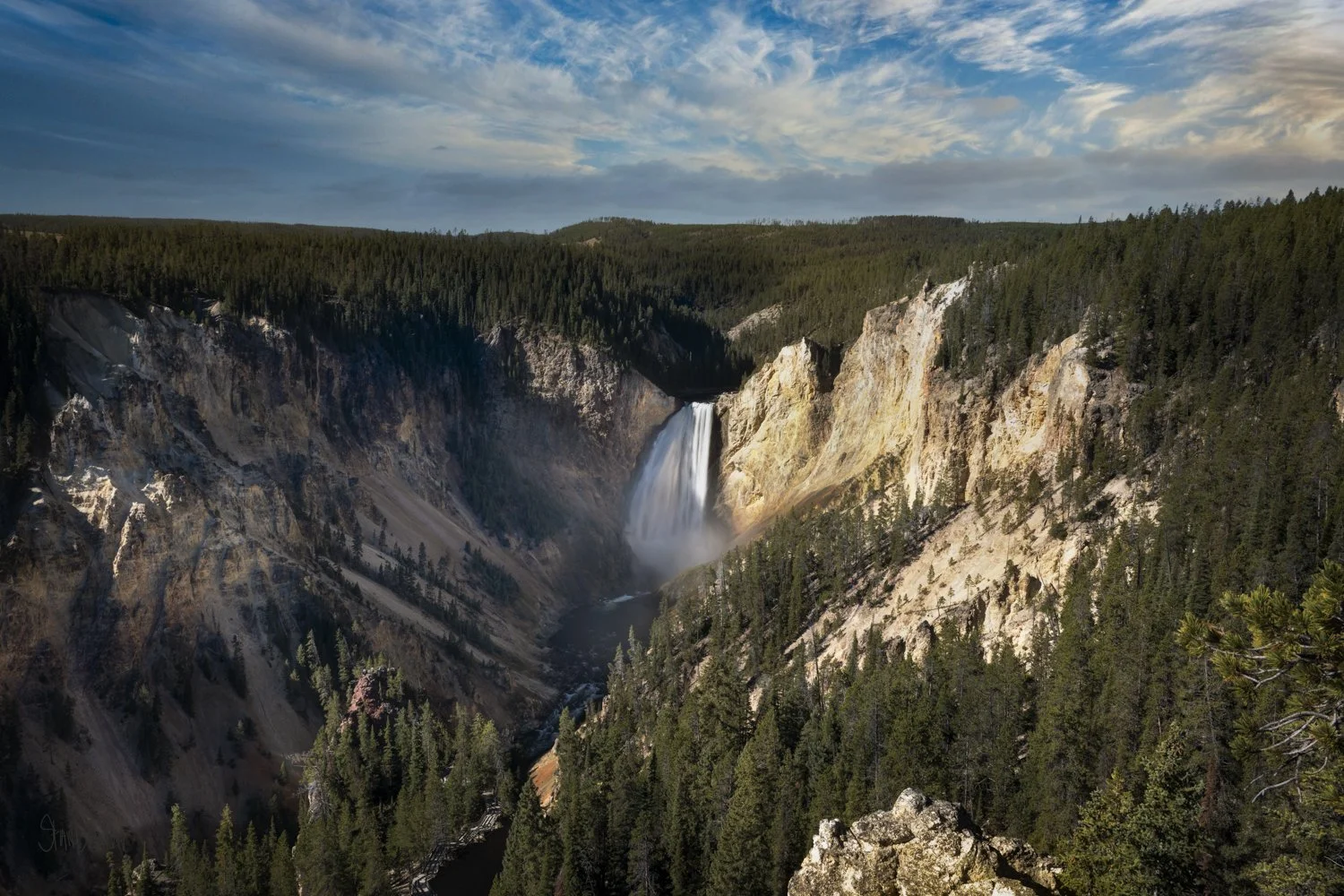 Morning sunlight illuminates the Grand Canyon of Yellowstone and Lower Falls.