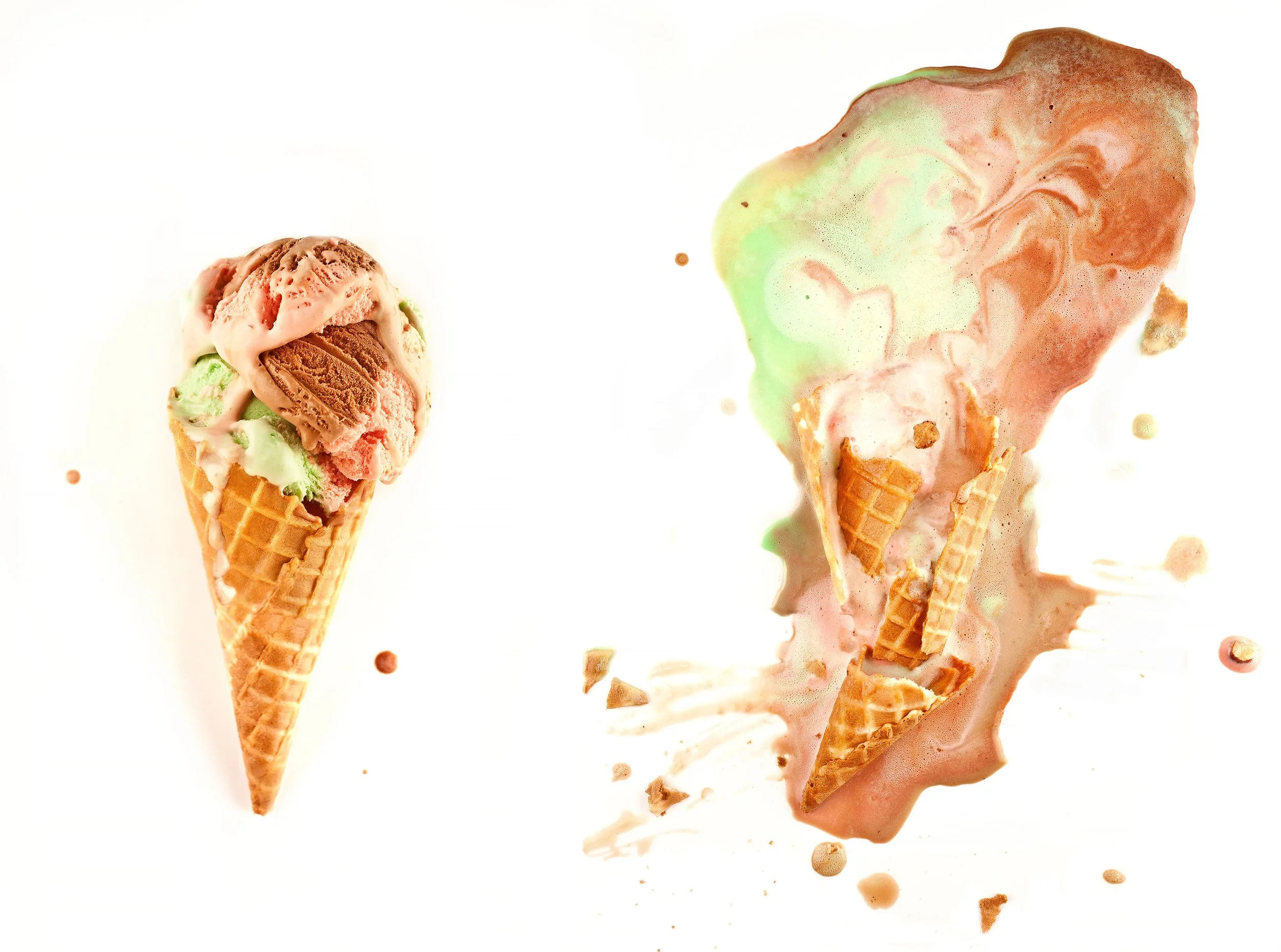 Colorful side by side ice cream cones with pink, mint green, and chocolate scoops,  one intact and one melted with cracked cone, on a white background
