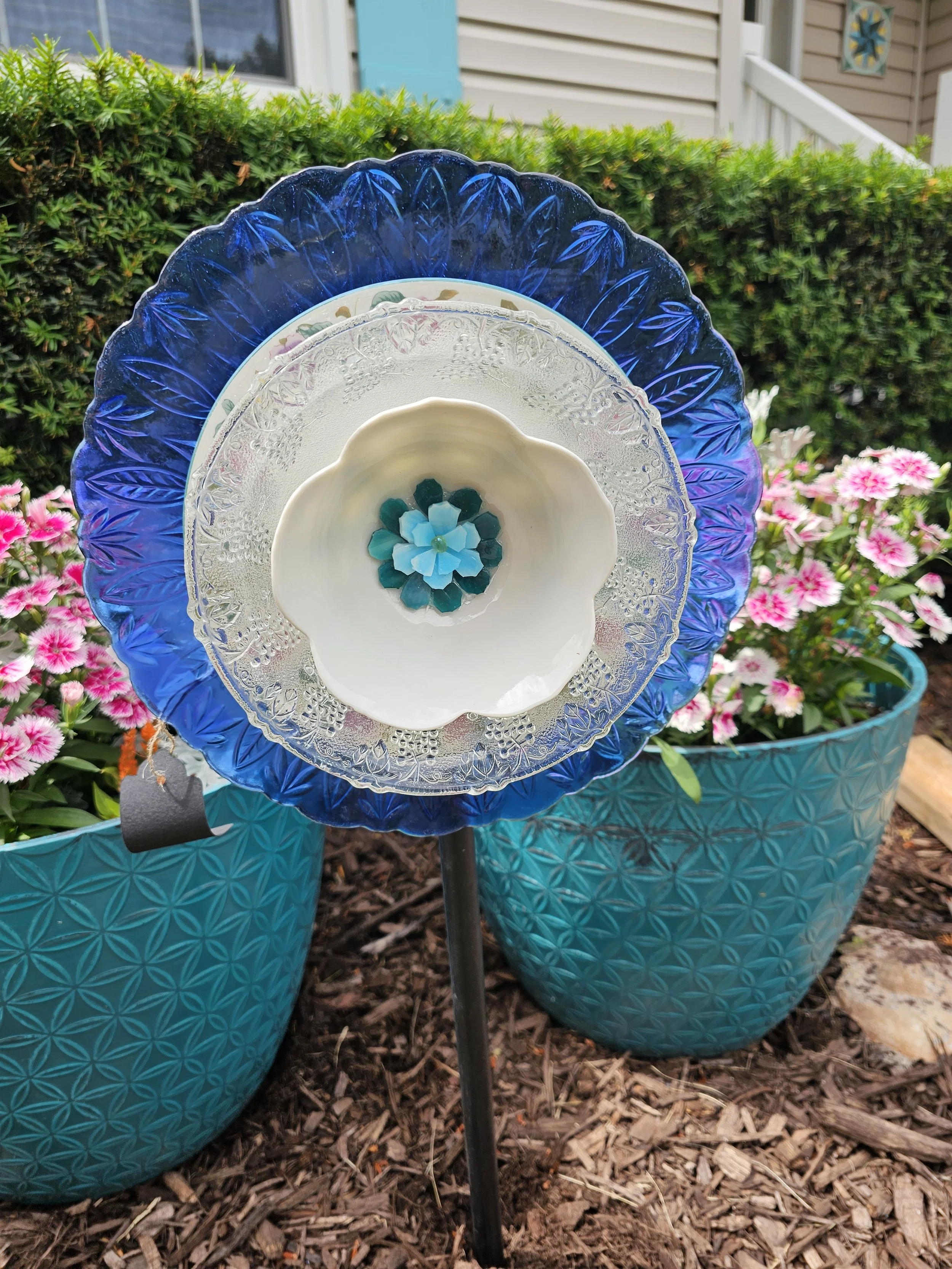 Blue and turquoise glass garden flower