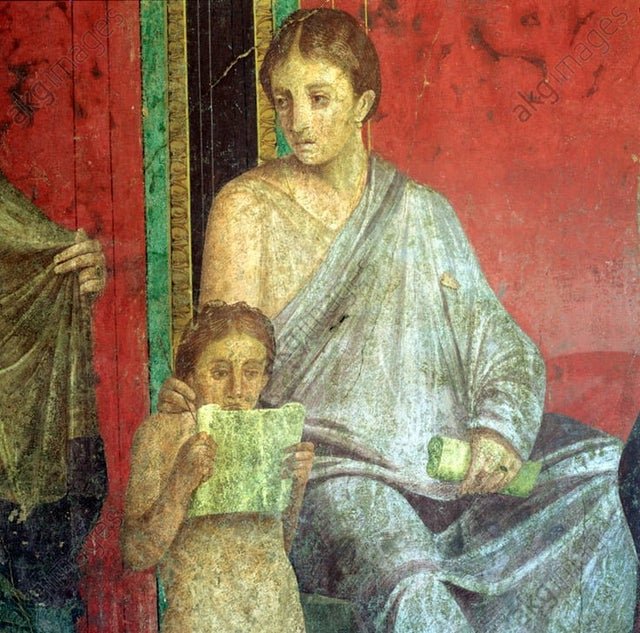 Fresco showing a seated young woman reading a scroll and a standing young boy holding a scroll in a classical setting.