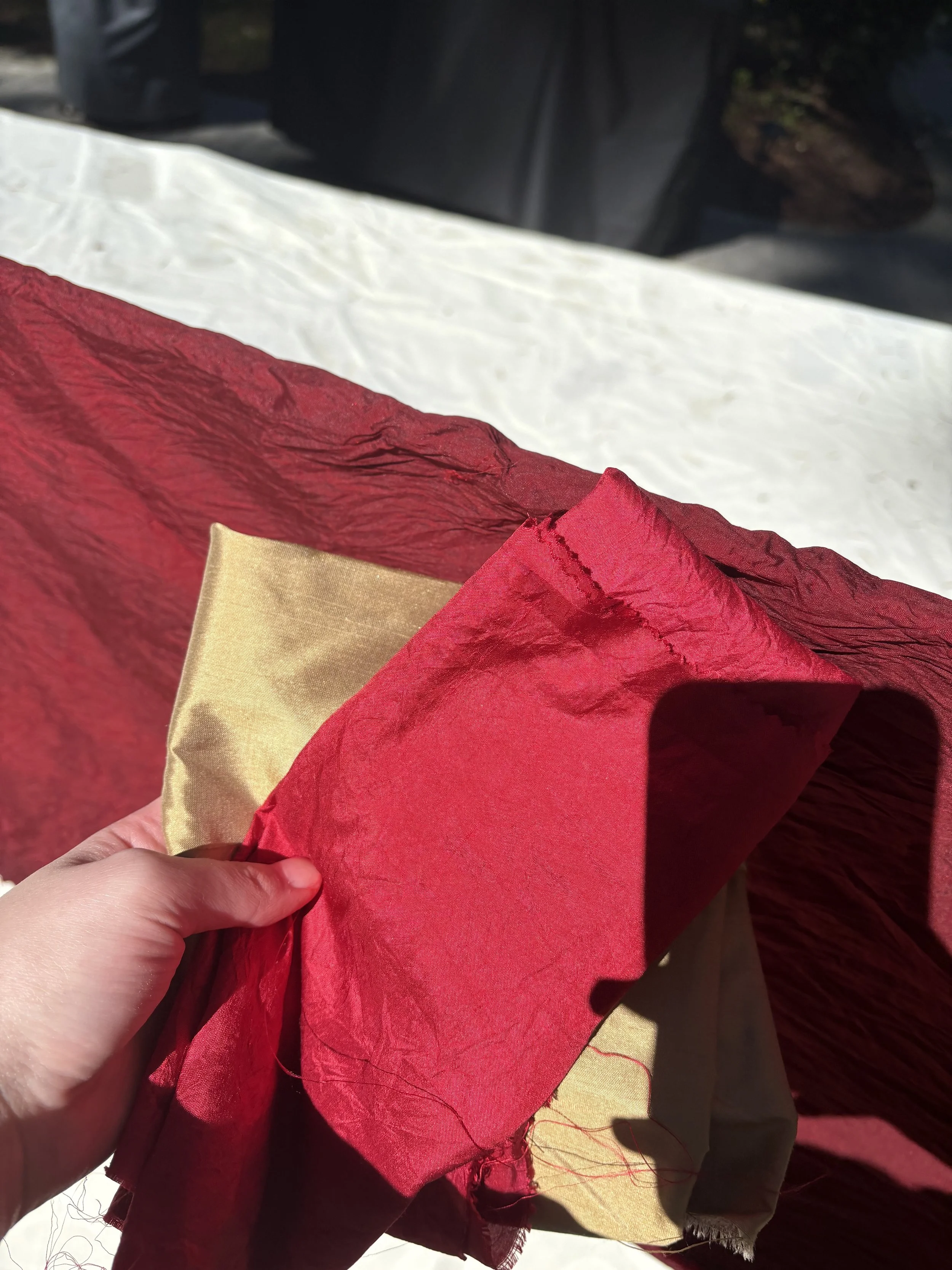 Dying the Silk Fabric from the Original gold to a dark red.