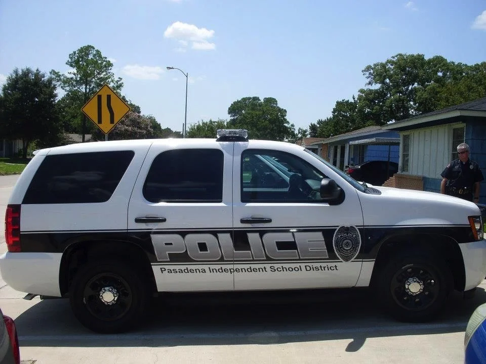 A Pasadena Independent School District police vehicle parked on a residential street.