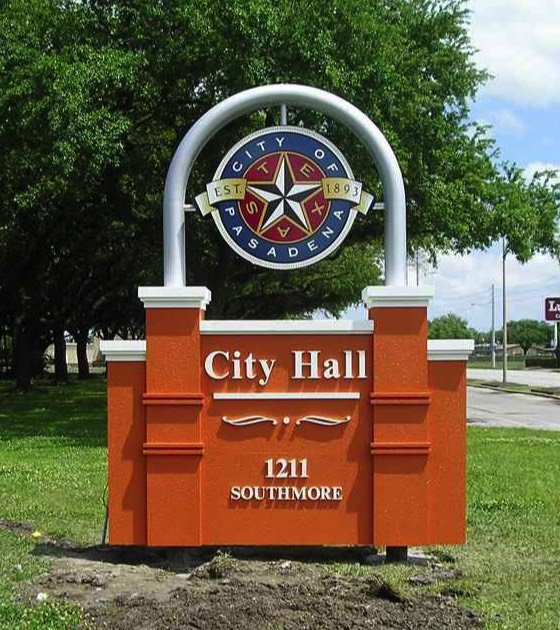 Sign for Southmore City Hall with city logo at the top, located at 1211 Southmore, in a green outdoor area.