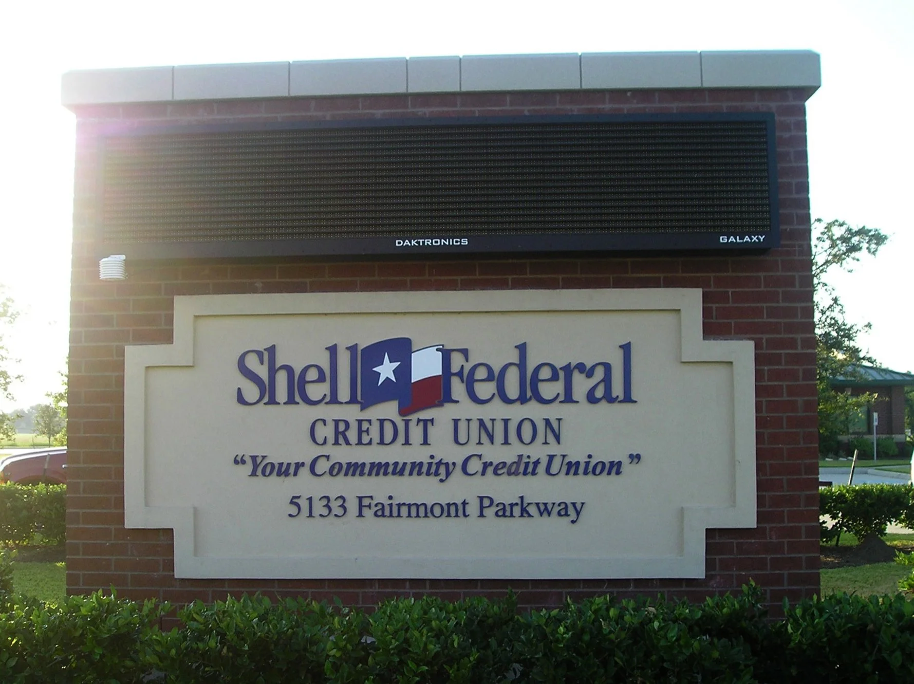 Sign for Shell Federal Credit Union with a digital billboard above it