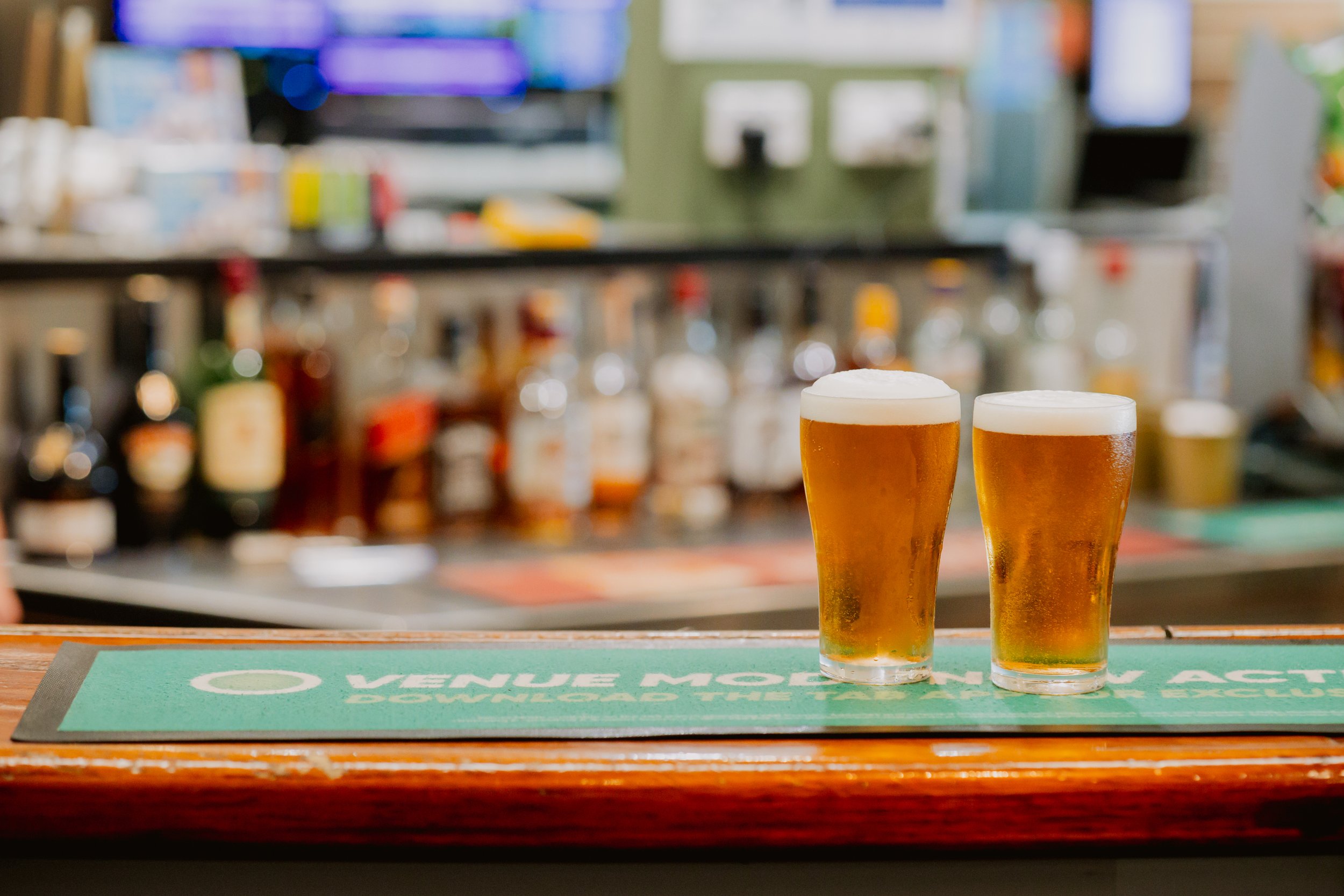 Two glasses of beer on the bar at Racecourse Hotel Werribee