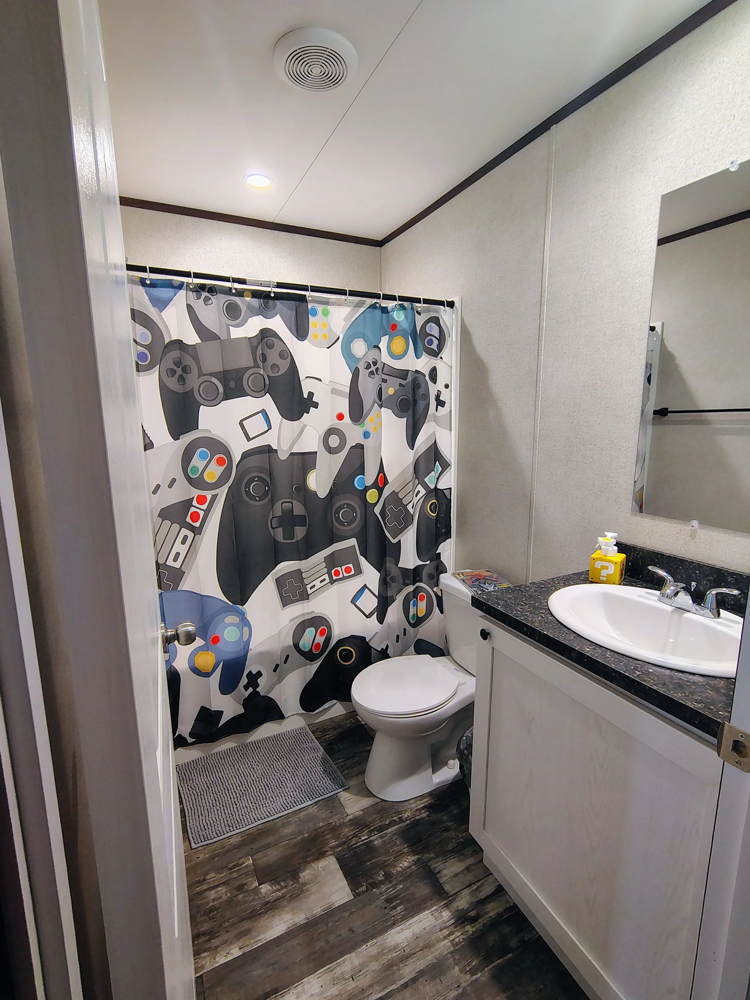 Full size bathroom with bathtub & shower. 