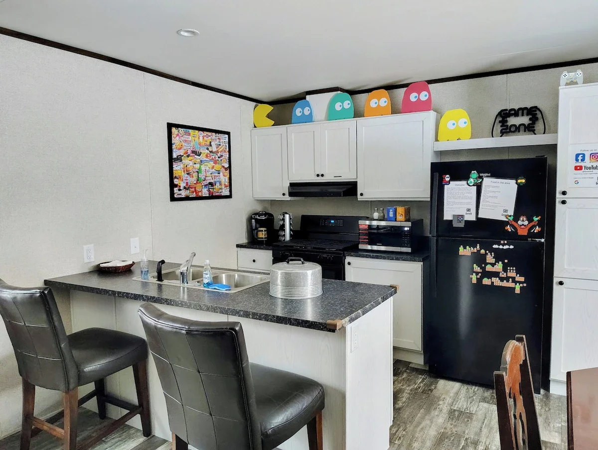 Full size kitchen with plates, utensils, limited pots and pans, and cooking essentials. 