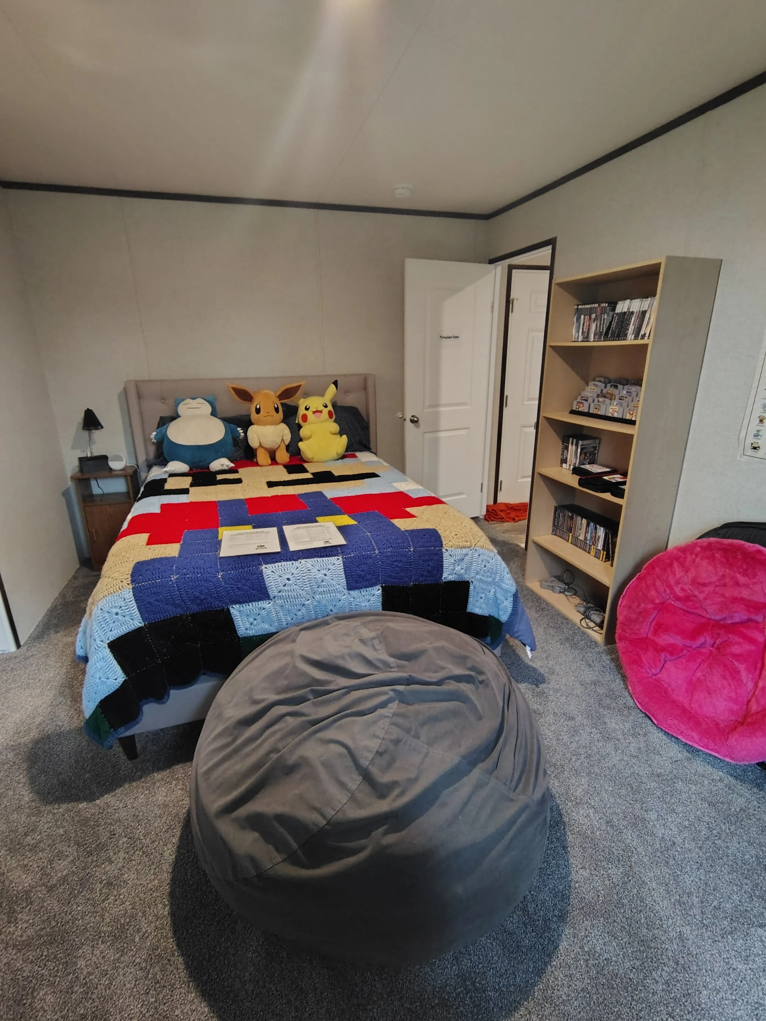 The Throwback Room has a queen bed, 2 Tvs, and 8 consoles to keep you busy!