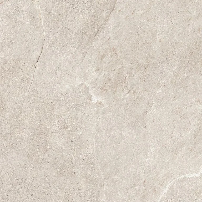 Superficie de piedra o concreto de color beige claro con textura lisa y algunos detalles de veta natural.