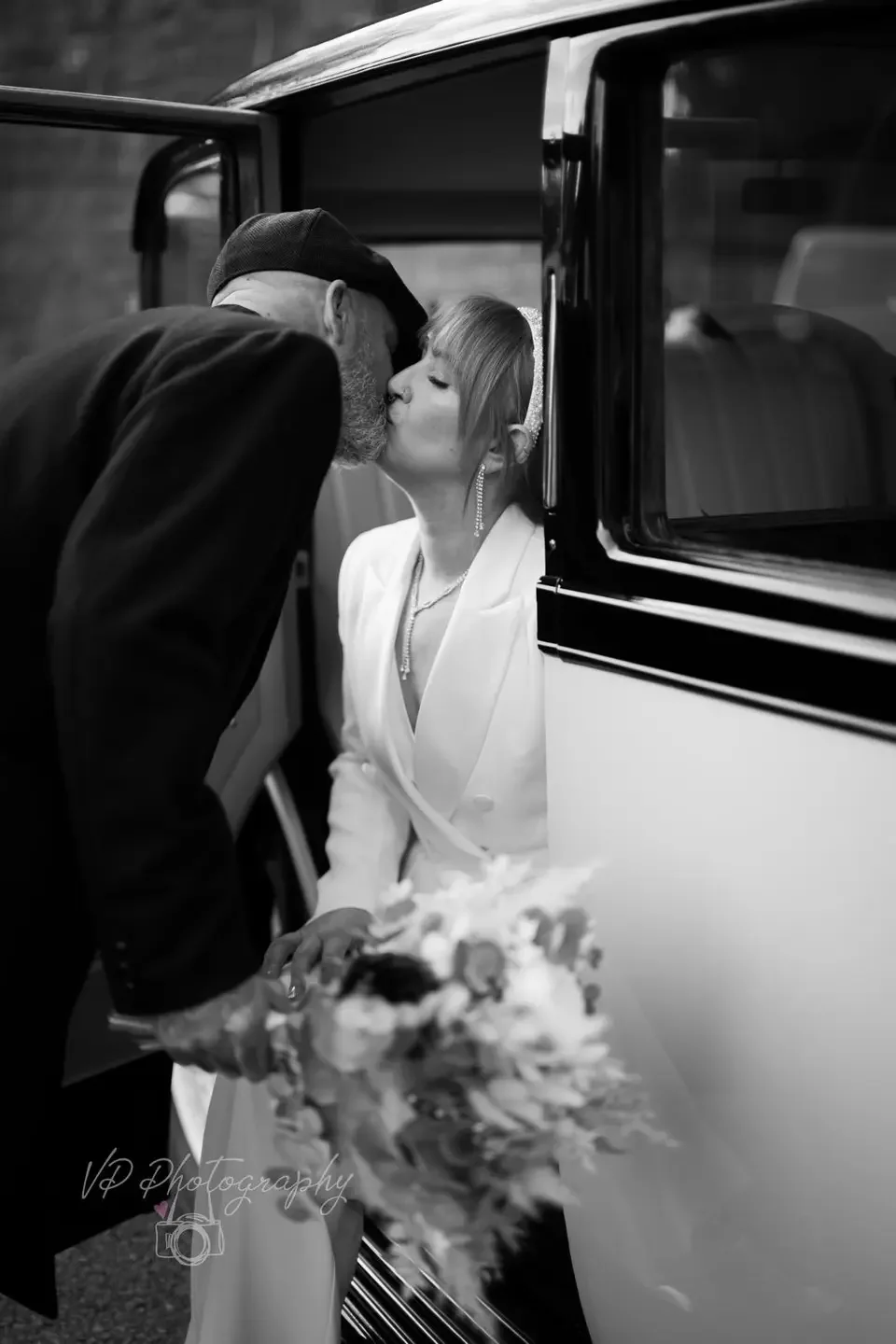 Vintage chauffeur-driven wedding car for a Sussex wedding