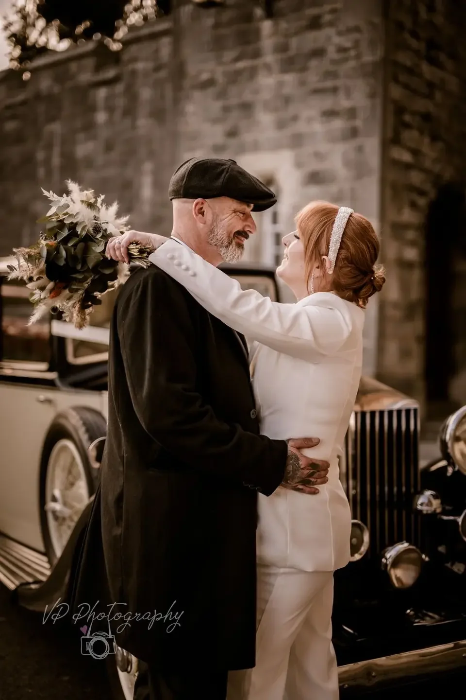 Vintage chauffeur-driven wedding car for a Sussex wedding