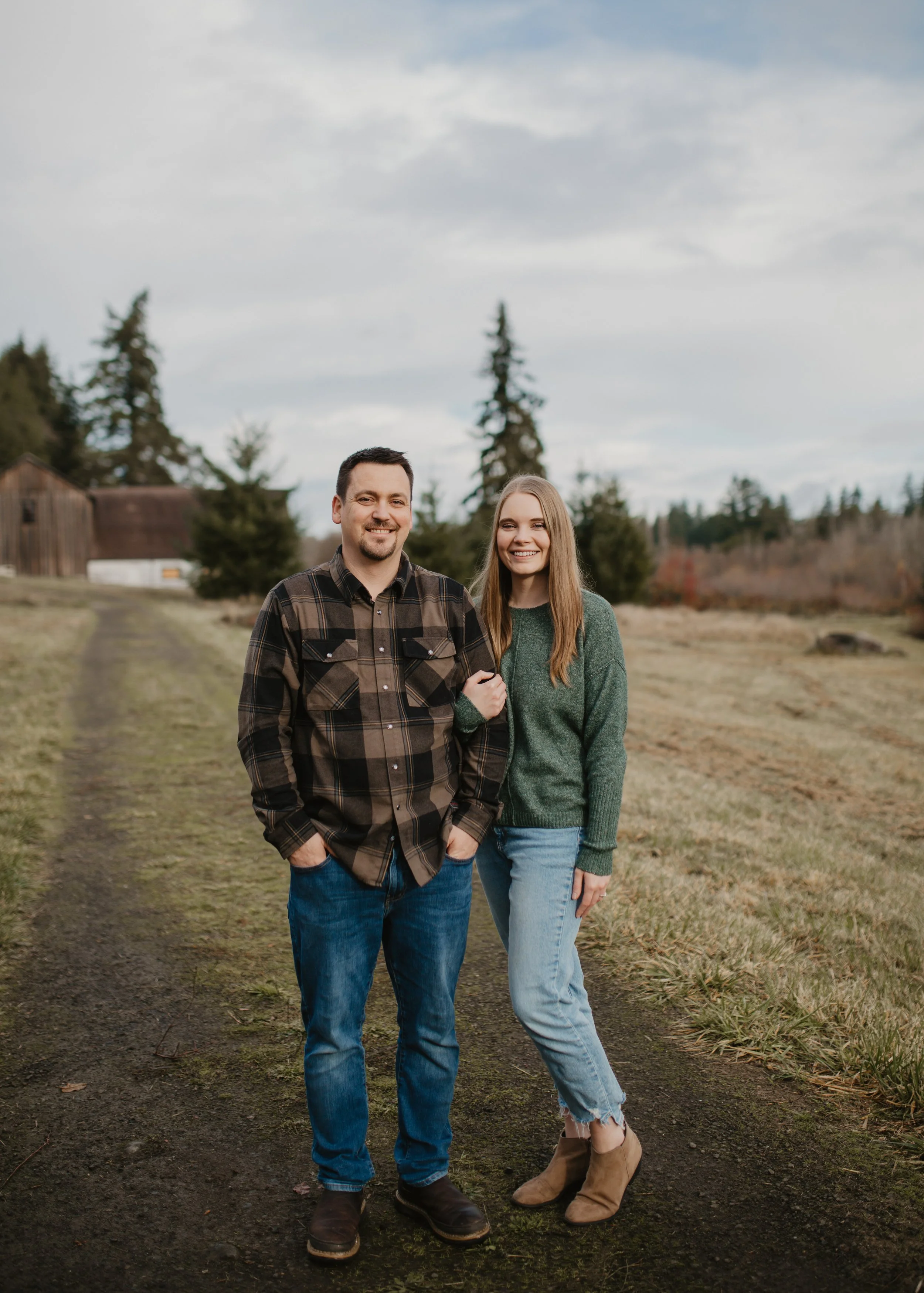 Alex, owner, and wife in professional photo at local farm in Port Orchard, WA.