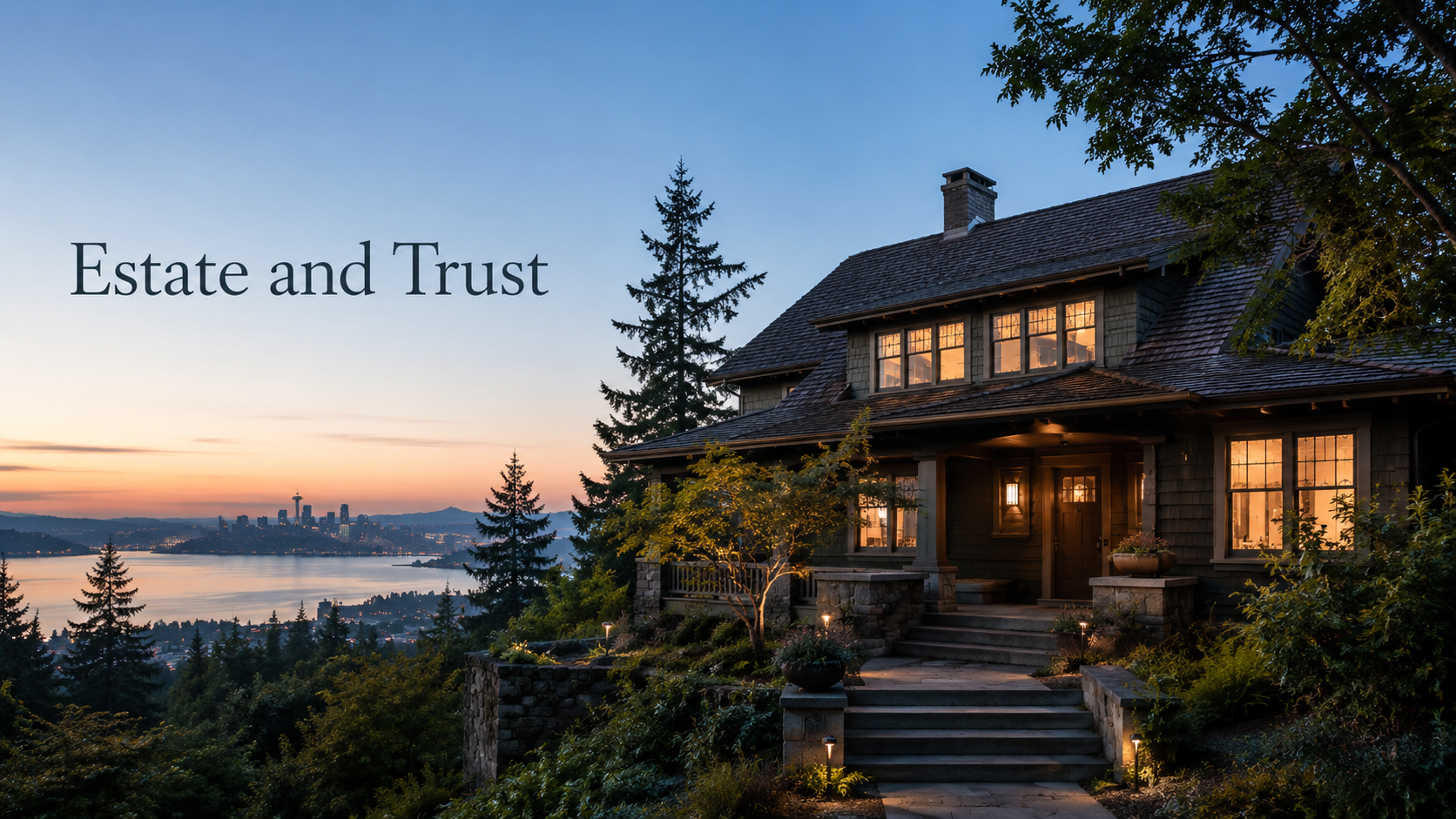 A large, dark-colored house with warm interior lighting, set on a hill with a garden and steps leading up to the front porch, overlooking Seattle city skyline and water at sunset.