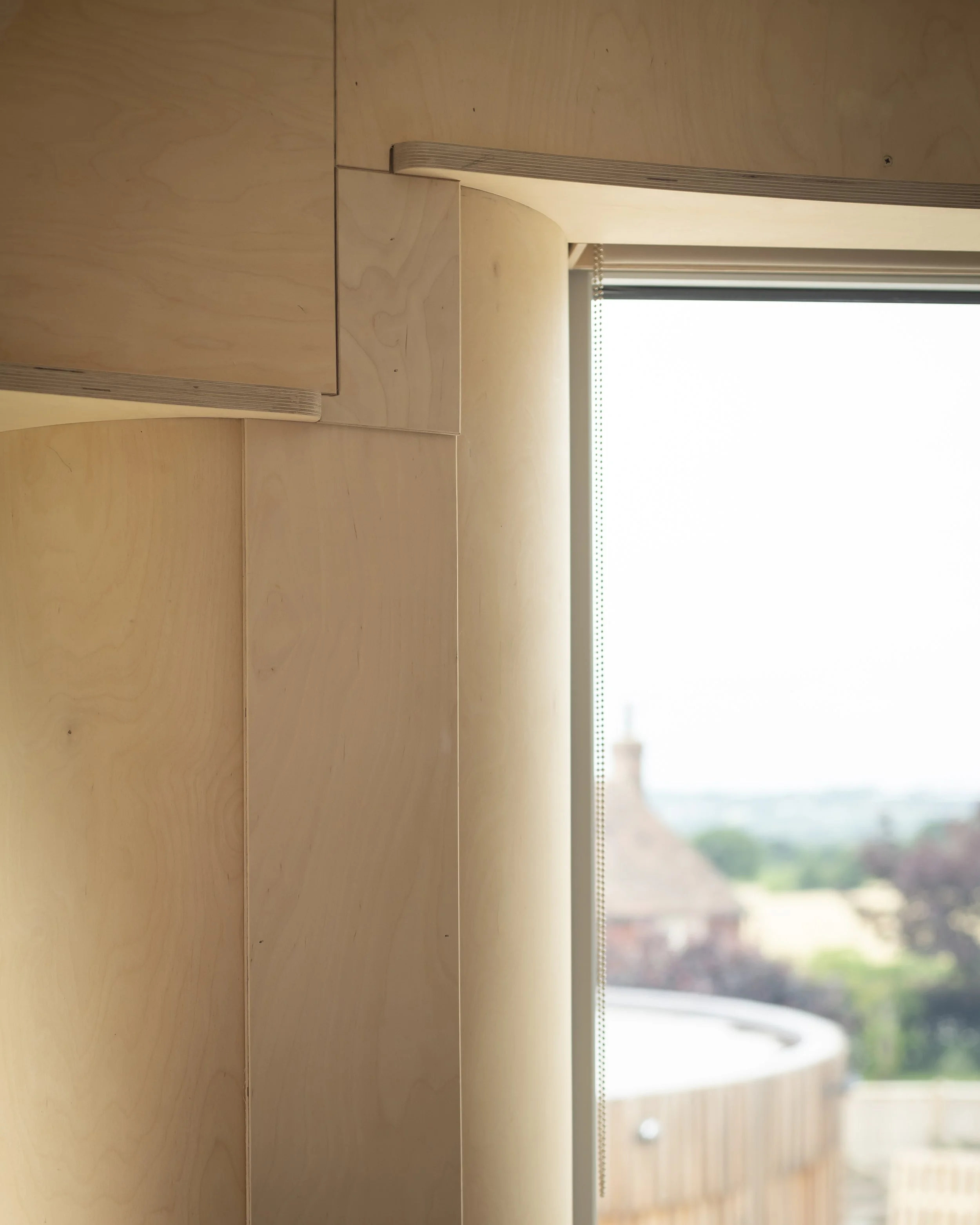 Fine joinery work around window reveal and wall treatment